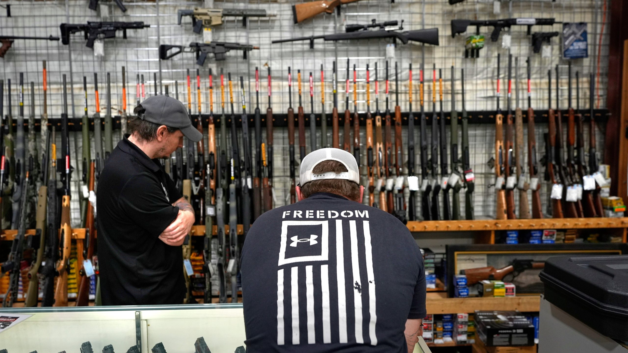 A customer shops at Maine Military Supply, Tuesday, Nov. 4, 2025, in Holden, Maine. (AP Photo/Robert F. Bukaty)