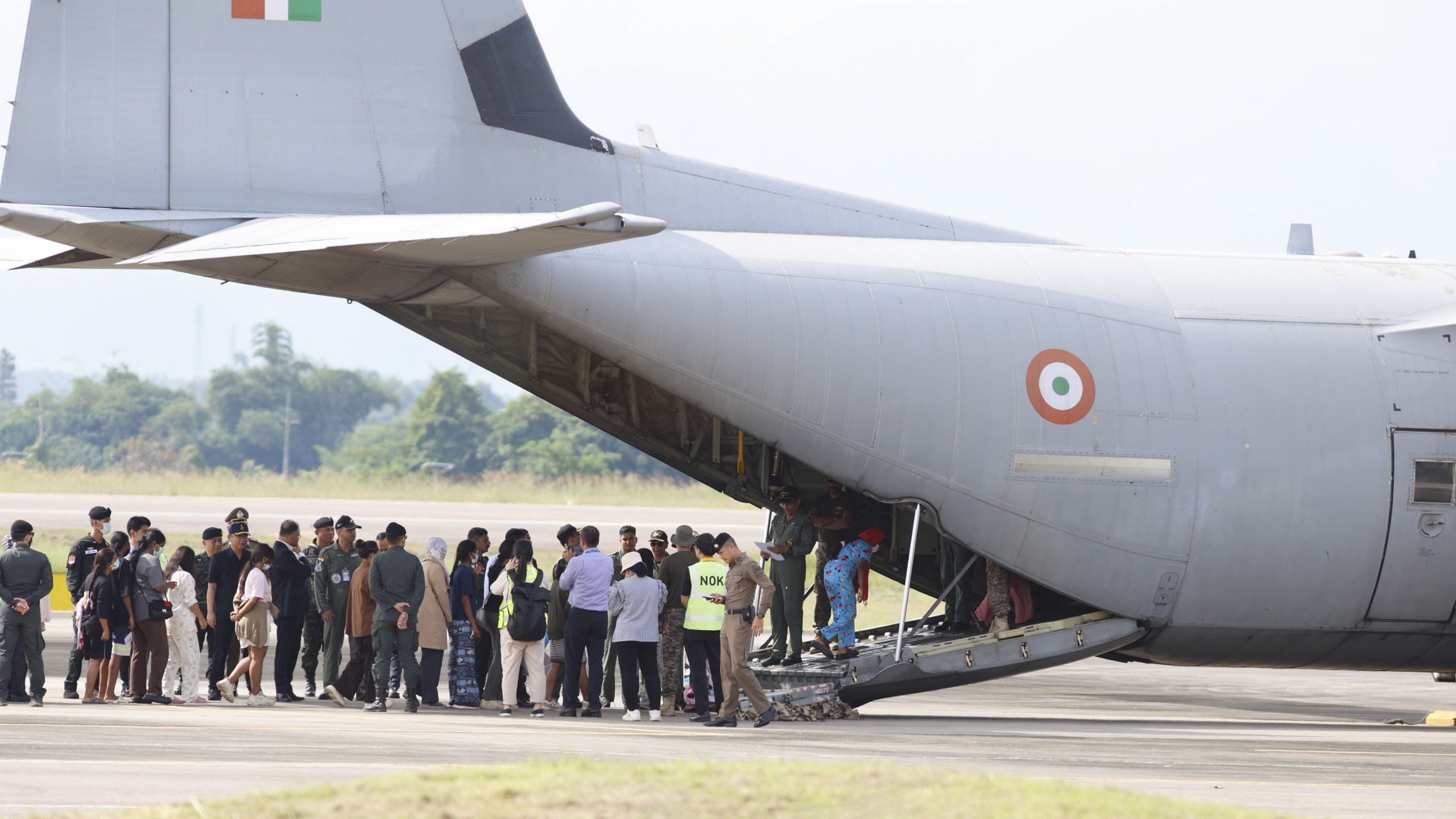 India nationals, believed to have worked at scam center in Myanmar, board a plane at Thailand's Mae Sot International Airport in Tak, before being sent back to India, Thursday, Nov. 6, 2025. (AP Photo/Sarot Meksophawannakul)