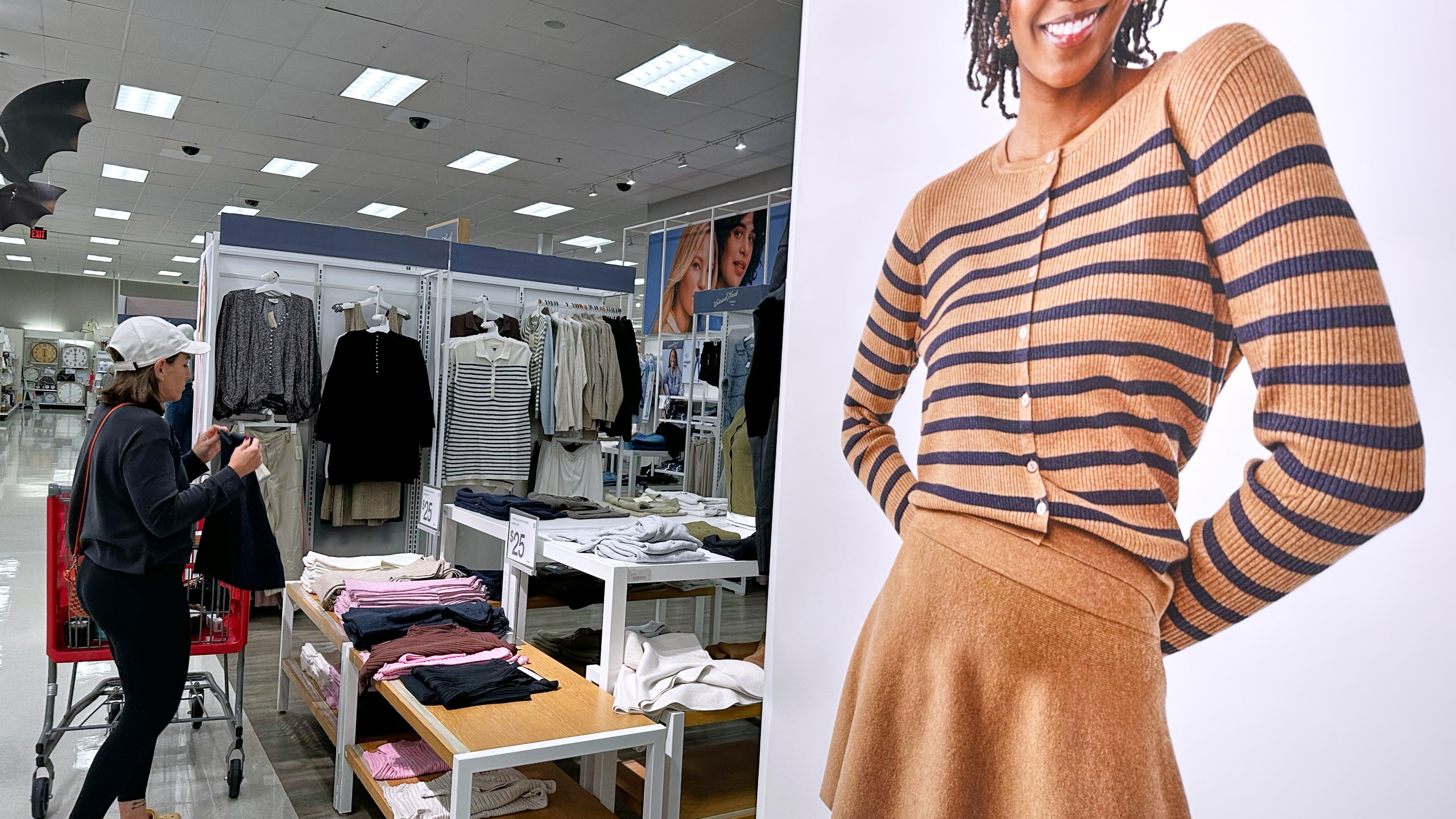 FILE - A shopper shops at a retail store in Arlington Heights, Ill., Tuesday, Sept. 23, 2025. (AP Photo/Nam Y. Huh, File)