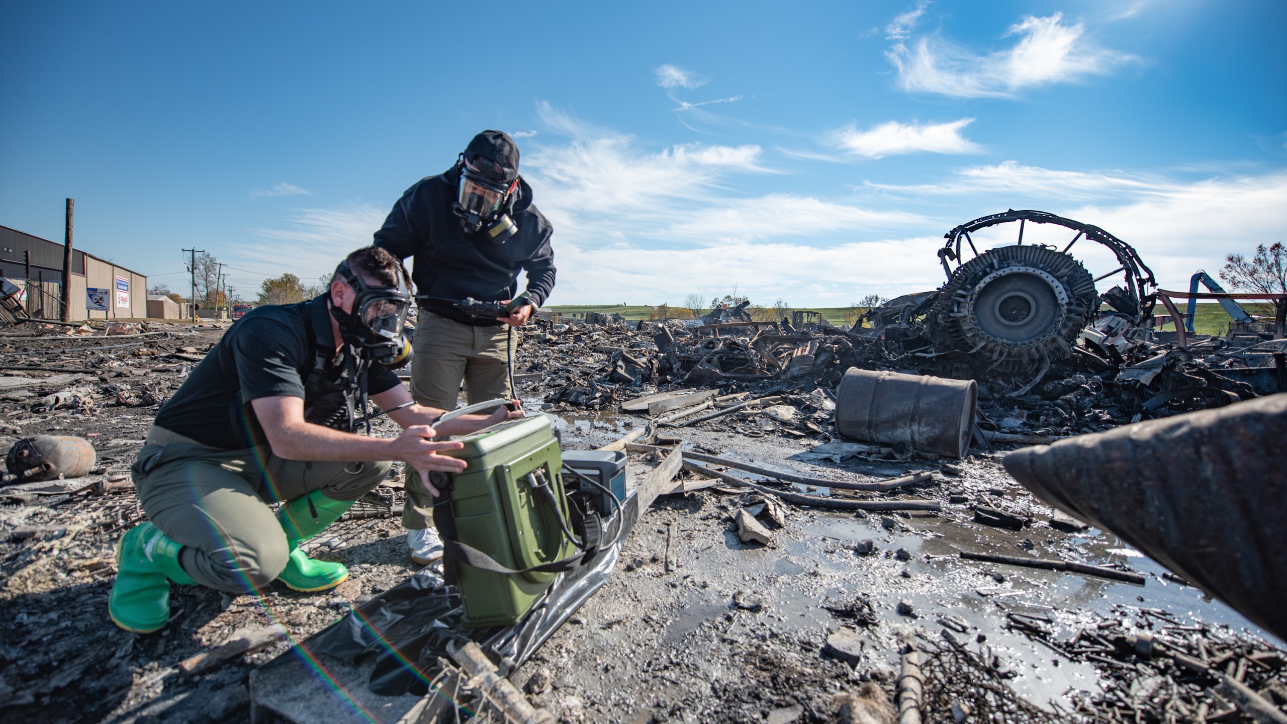 In this photo provided by U.S. Air National Guard, members of the Kentucky National Guard's 41st Civil Support Team use a portable gas chromatograph mass spectrometer at the site of a fatal airplane crash in Louisville, Ky., on Wednesday, Nov. 5, 2025. (Phil Speck/U.S. Air National Guard via AP)