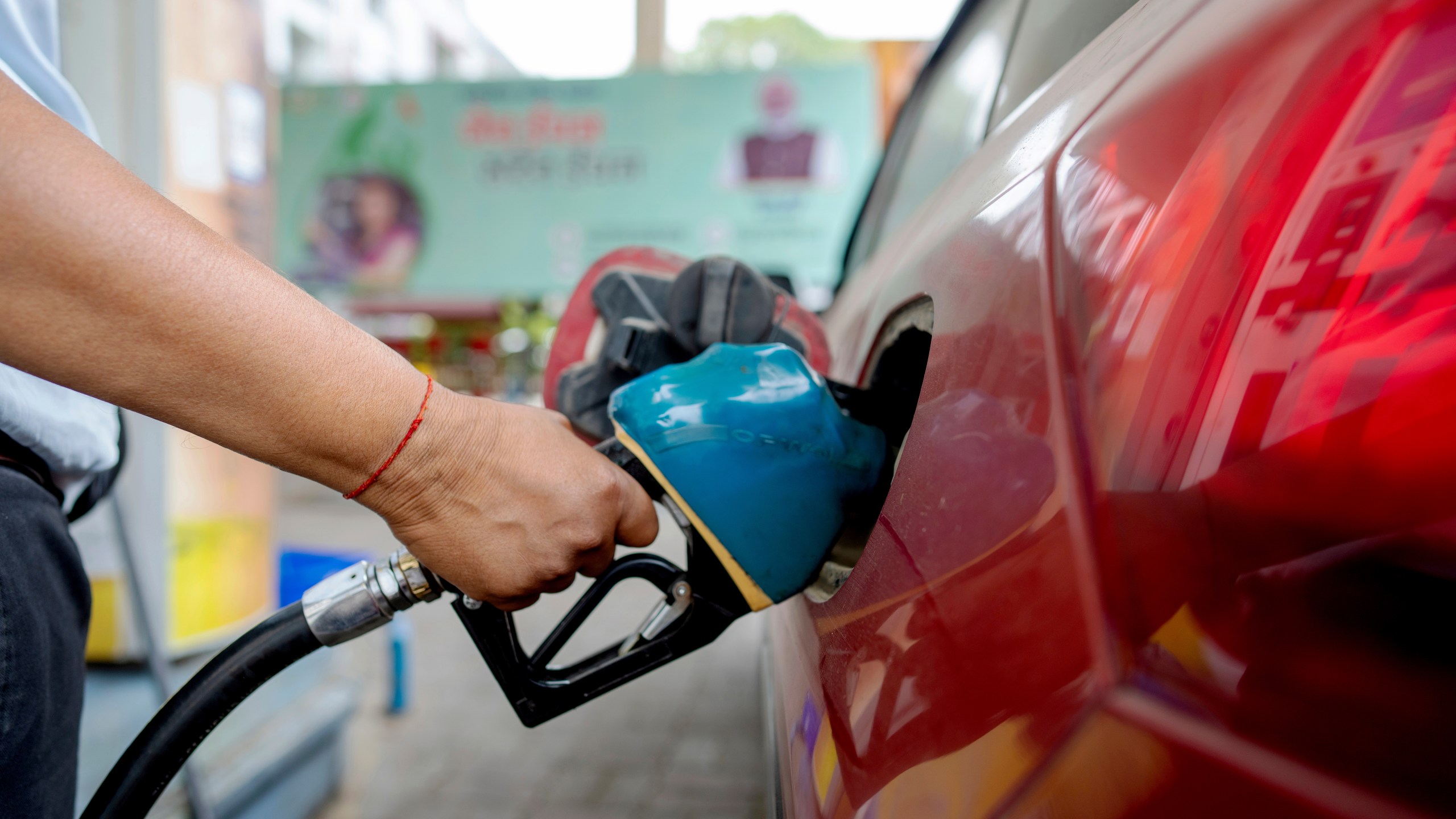FILE - An Indian man fills petrol at a fuel pump in Prayagraj, in the northern Indian state of Uttar Pradesh, May 5, 2025. (AP Photo/Rajesh Kumar Singh, File)