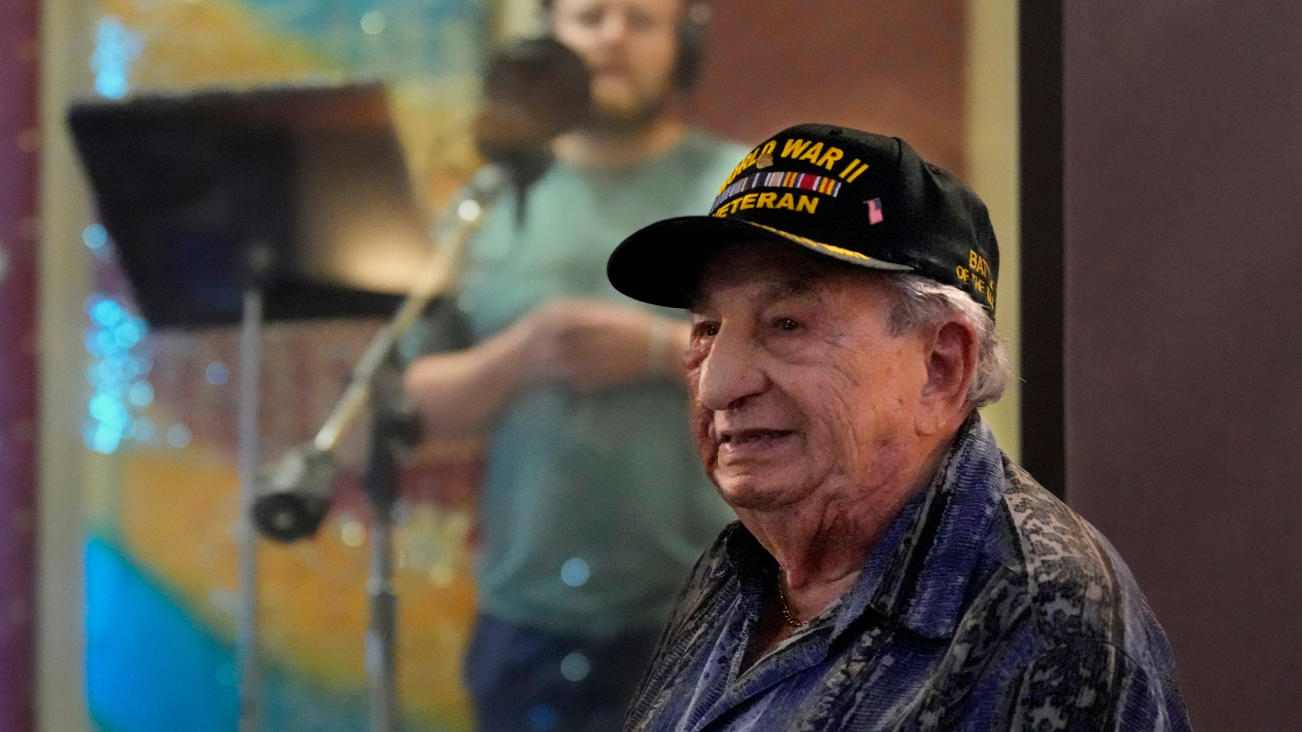 Irving Locker, a 101-year-old veteran of World War II, D-Day and the Battle of the Bulge, listens as Jesse Wayne Taylor, left, records a song based on Locker's military experience on Wednesday, Sept. 9, 2025, in Nashville, Tenn. (AP Photo/Mark Humphrey)