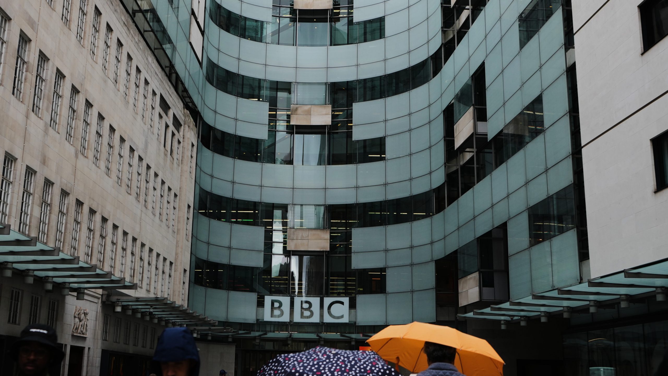 People walk outside BBC Broadcasting House in London, Tuesday, Nov. 11, 2025. (AP Photo/Kirsty Wigglesworth)