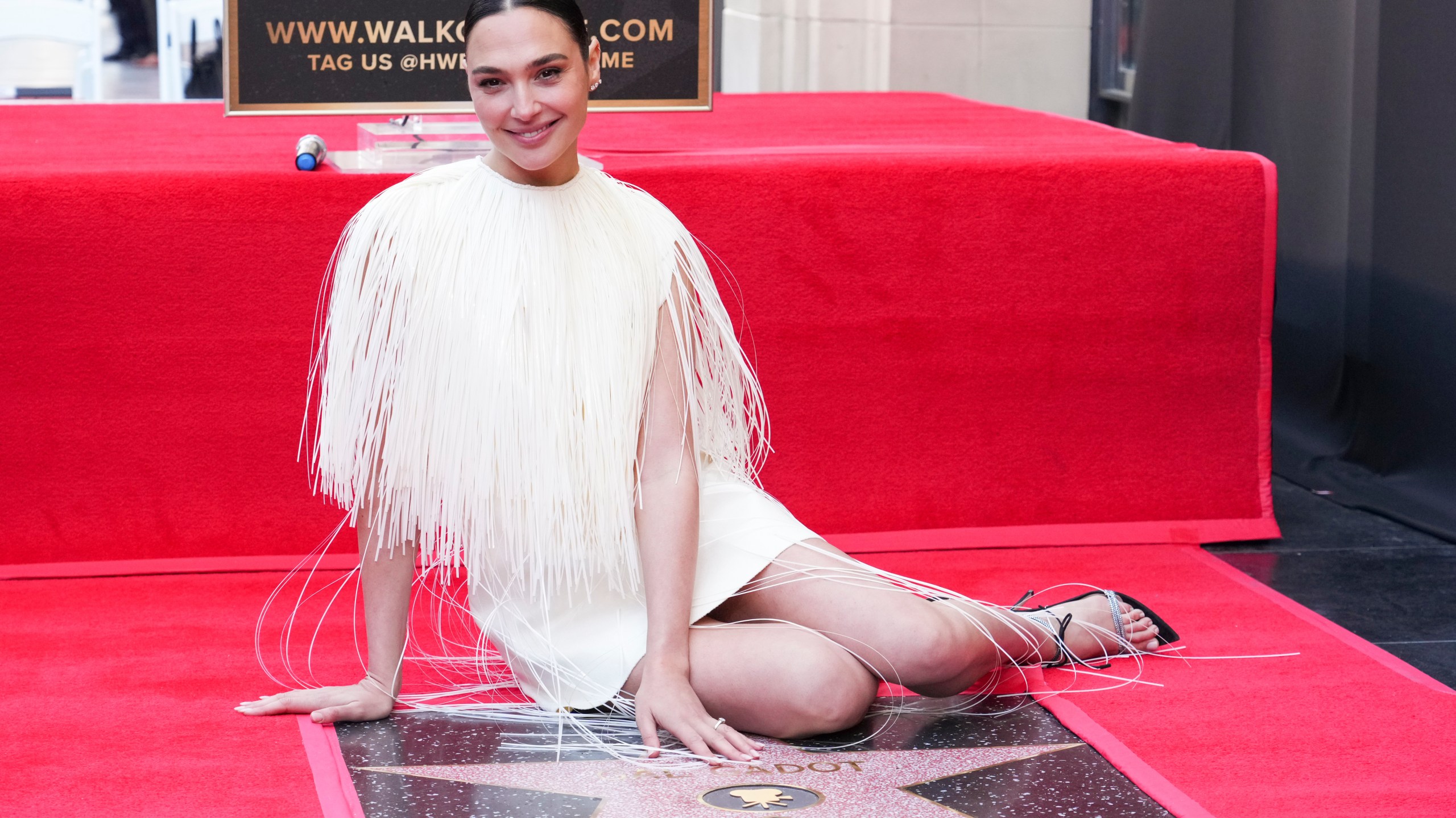 Gal Gadot poses with her new star on the Walk of Fame