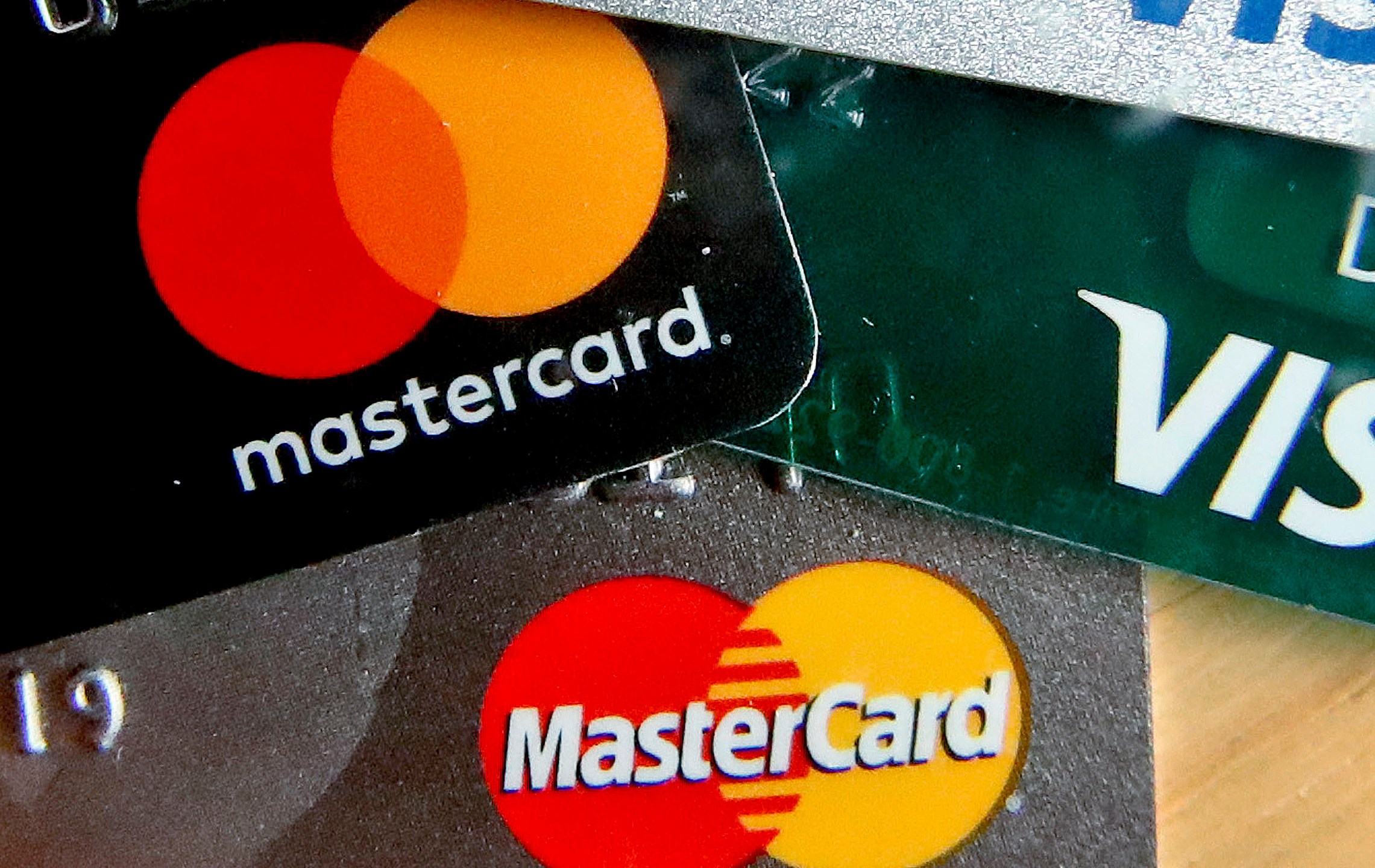 FILE - In this Feb. 20, 2019, file photo are Mastercard and Visa credit cards in Zelienople, Pa. (AP Photo/Keith Srakocic, File)