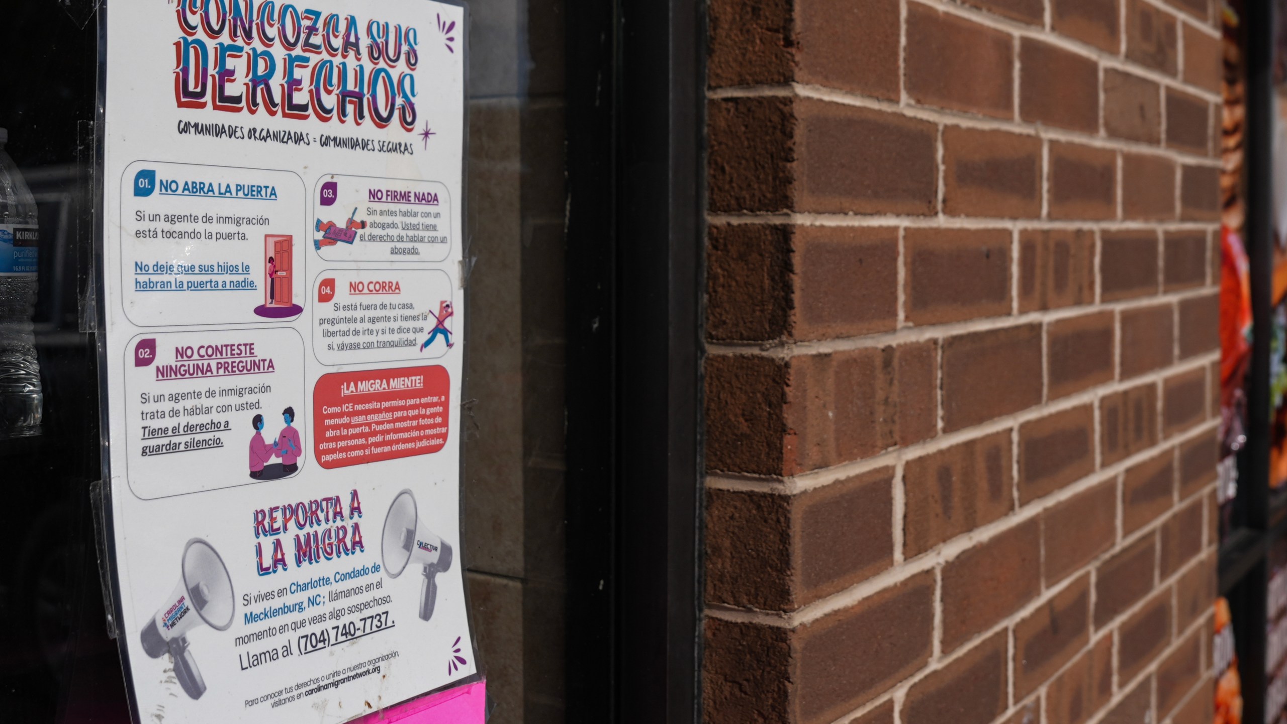 A sign in Spanish that reads at top: "Know Your Rights" is displayed outside of a restaurant store front, Thursday, Nov. 13, 2025, in Charlotte, N.C. (AP Photo/Matt Kelley)