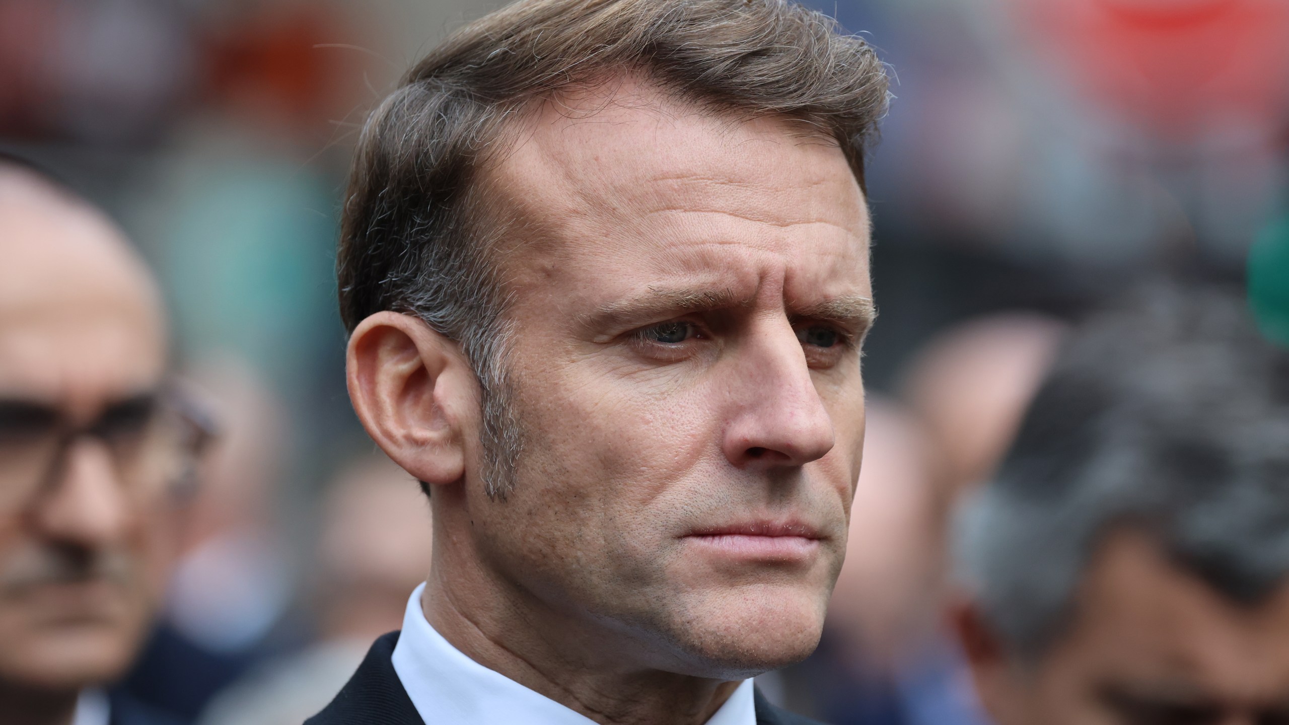 French President Emmanuel Macron pays his respects to victims near Le Bonne Biere cafe, Thursday Nov. 13, 2025 in Paris during ceremonies marking the 10th anniversary of terrorist attacks that killed 132 people and injured hundreds. (Ludovic Marin, Pool photo via AP)