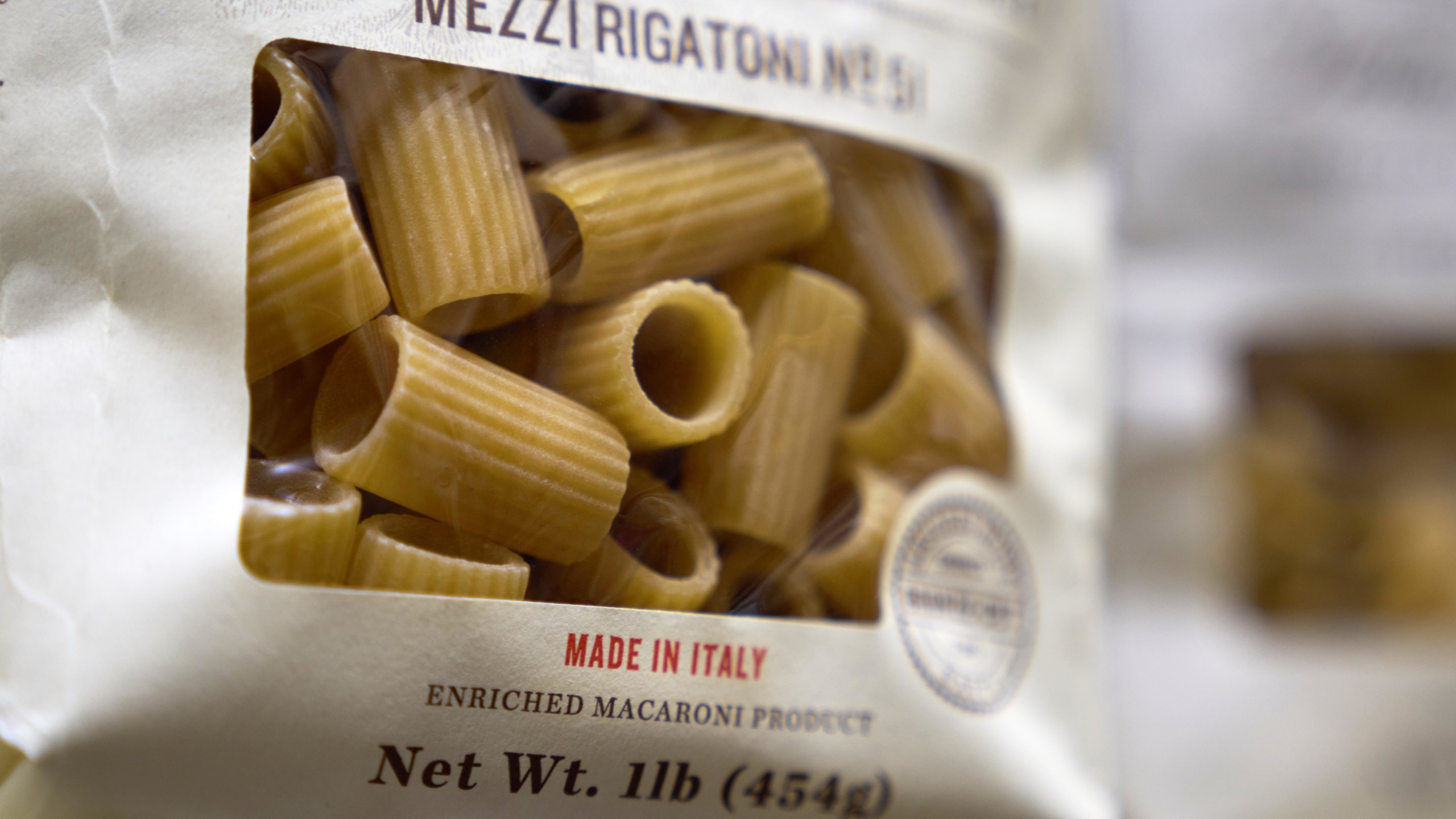 Boxes of imported Italian pasta are seen on shelves, Tuesday, Nov. 11, 2025, in Detroit. (AP Photo/Ryan Sun)