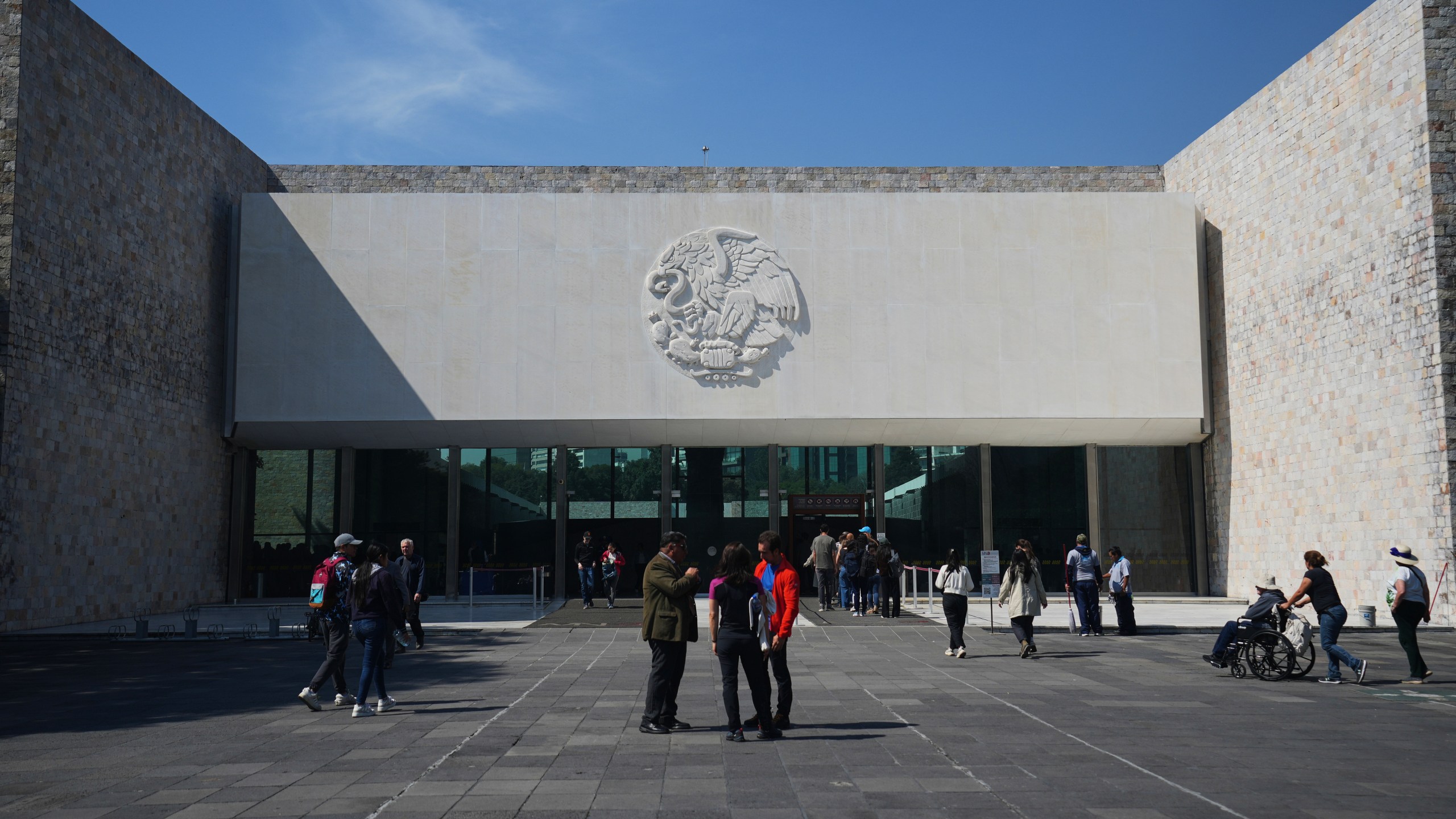 The entrance of Mexico City's National Museum of Anthropology features Mexico's national emblem on its façade, Friday, Nov. 14, 2025. (AP Photo/Claudia Rosel)