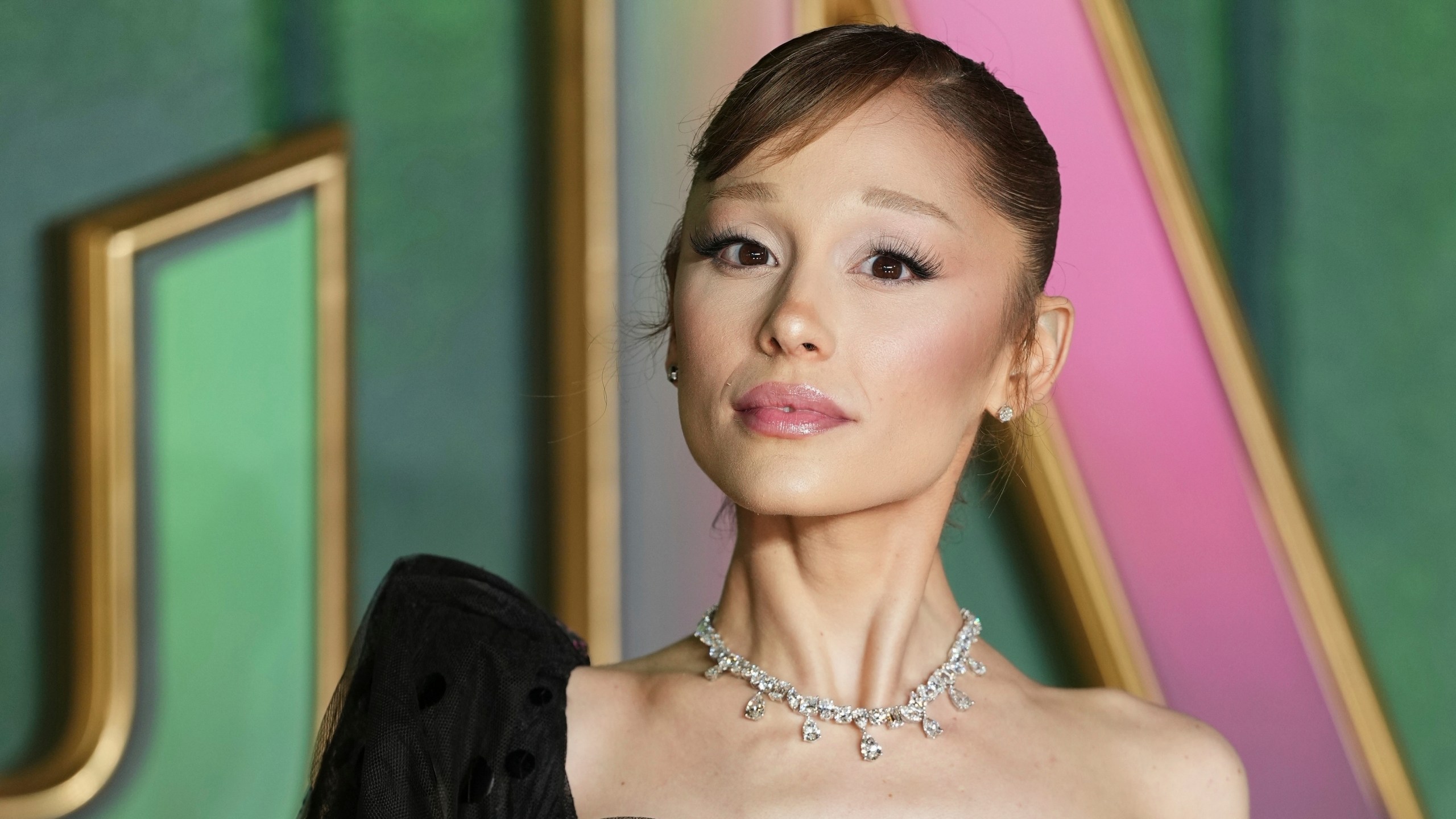 FILE - Ariana Grande poses for photographers upon arrival at the premiere of the film "Wicked For Good" in London, Nov. 10, 2025. (Photo by Scott A Garfitt/Invision/AP, File)