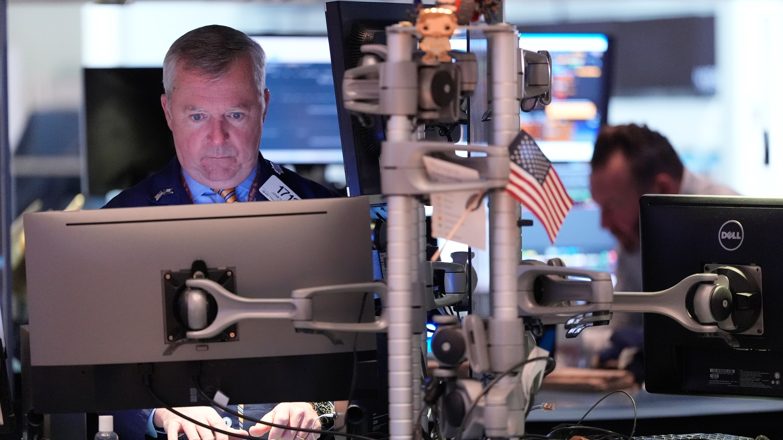 James Lamb works on the floor at the New York Stock Exchange in New York, Thursday, Nov. 13, 2025. (AP Photo/Seth Wenig)