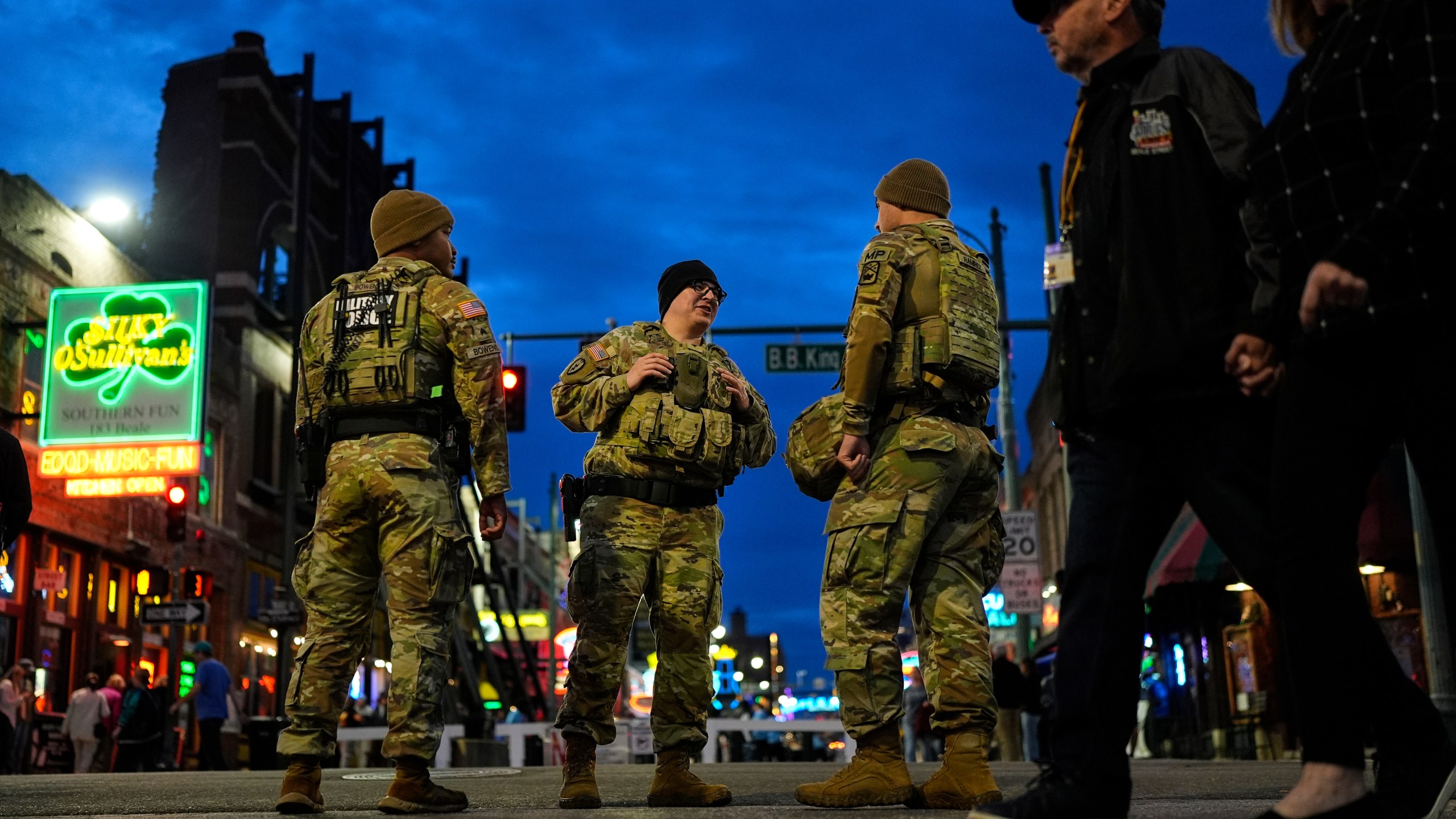 Members of the National Guard stand watch at the intersection of B.B. King Blvd. and Beale Street, Friday, Oct. 24, 2025, in Memphis, Tenn. (AP Photo/George Walker IV)
