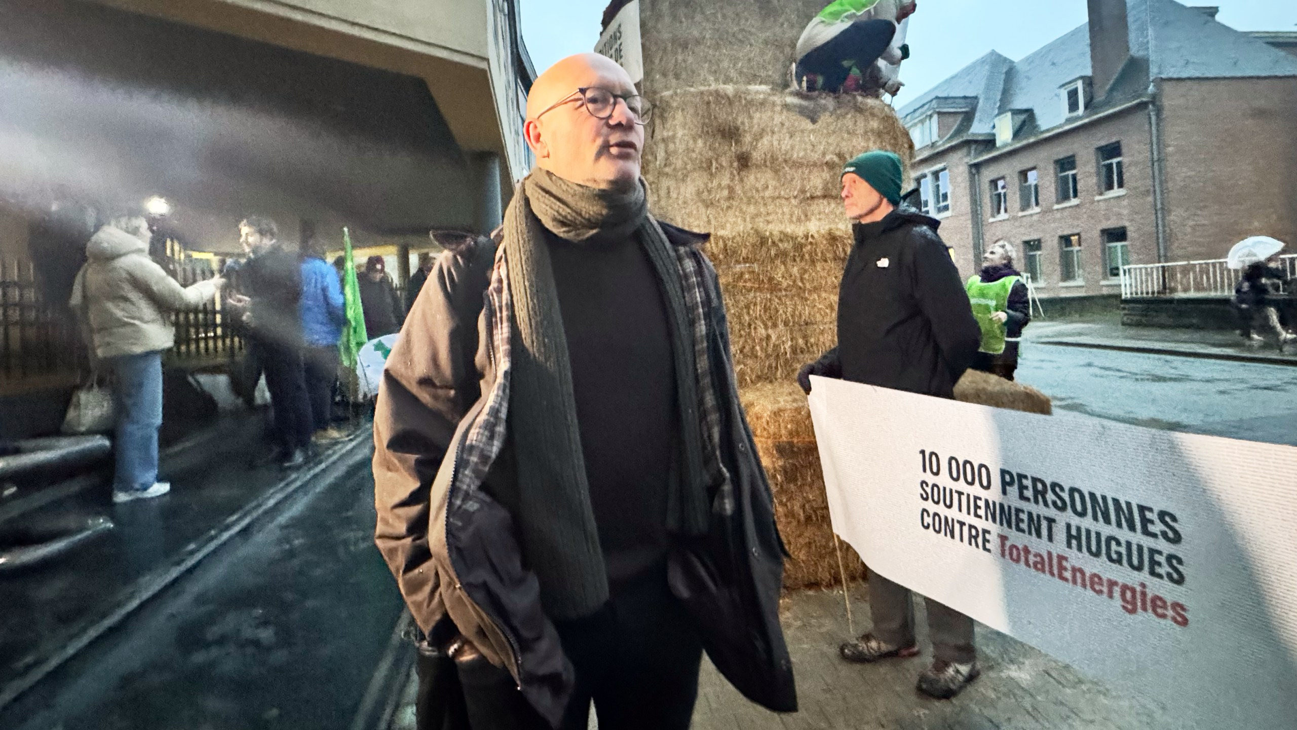 Belgian farmer Hugues Falys stands outside a court house as French oil giant TotalEnergies is on trial, accused by Falys and three environmental groups of bearing responsibility for climate change, Wednesday, Nov. 19, 2025 in Tournai, Belgium. (AP Photo/Sylvain Plazy)