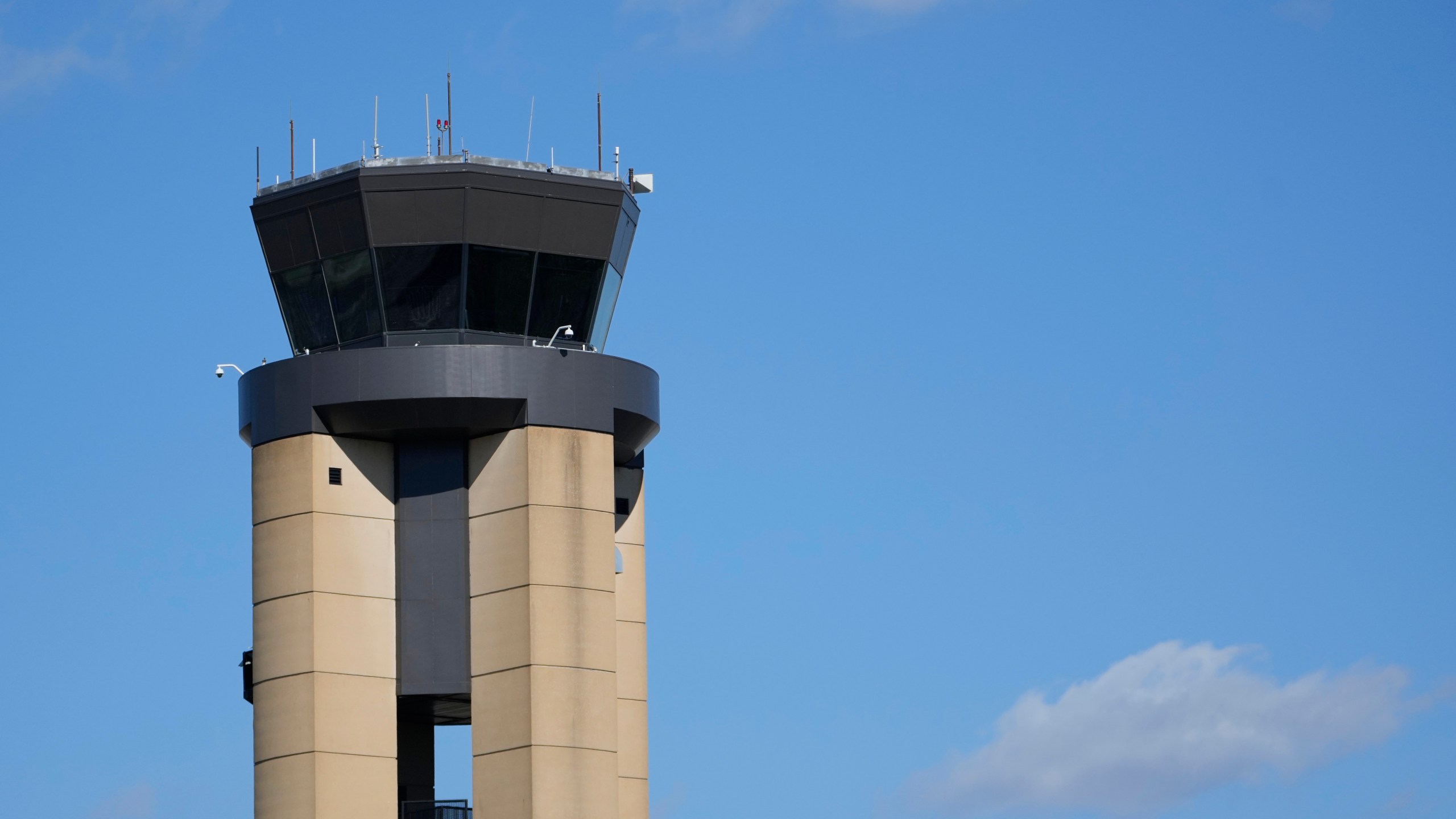 The control tower at Nashville International Airport stands Friday, Oct. 31, 2025, in Nashville, Tenn. (AP Photo/George Walker IV)