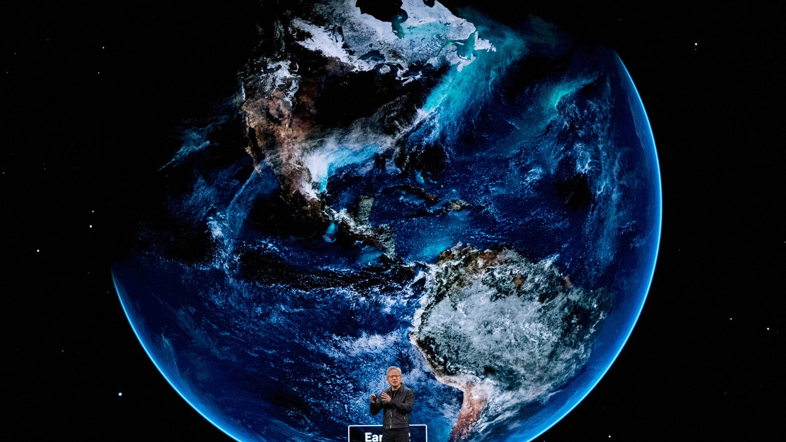 NVIDIA CEO Jensen Huang speaks on how AI infrastructure and AI factories that generate intelligence at scale are powering a new industrial revolution, at Washington Convention Center, Tuesday, Oct. 28, 2025, in Washington. (AP Photo/Manuel Balce Ceneta)