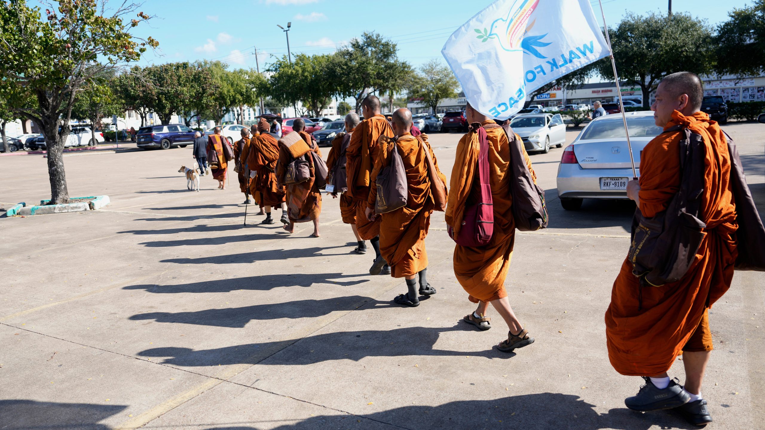The Buddhist monks from the Huong Dao Vipassana Bhavana Center in Fort Worth, who are undertaking a 2,300 mile pilgrimage of "Walk for Peace," arrive for a welcome ceremony at Hong Kong City Mall in Houston, Friday, Nov. 14, 2025. (Melissa Phillip/Houston Chronicle via AP)