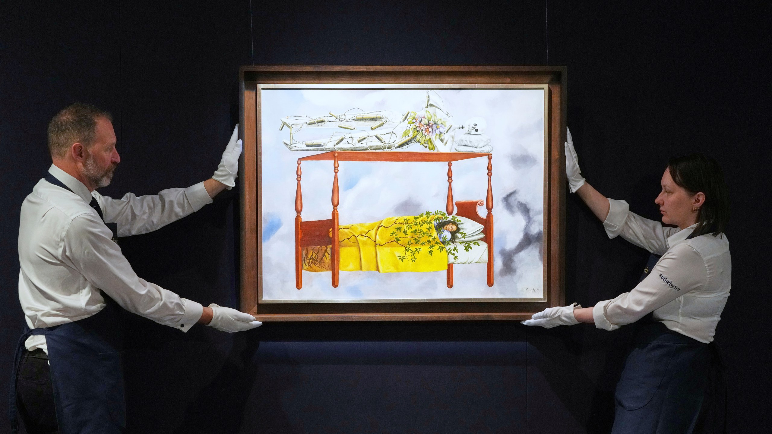 FILE - A painting by Frida Kahlo titled "El sueño (La cama)" or (The Dream (The Bed), is displayed at Sotheby's auction rooms in London, Sept. 19, 2025. The painting, estimated at 40-60 million US dollars, is part of a collection of surrealist masterpieces unveiled ahead of its upcoming sale in New York. (AP Photo/Kirsty Wigglesworth, File)