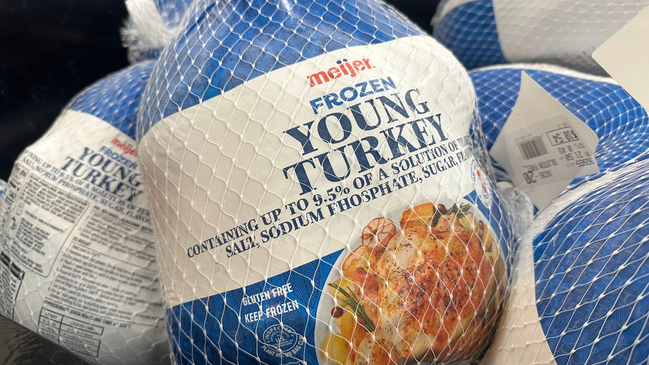Frozen turkeys are on display at a Meijer store Friday, Nov. 21, 2025, in Canton Township, Mich. (AP Photo/Mike Householder)