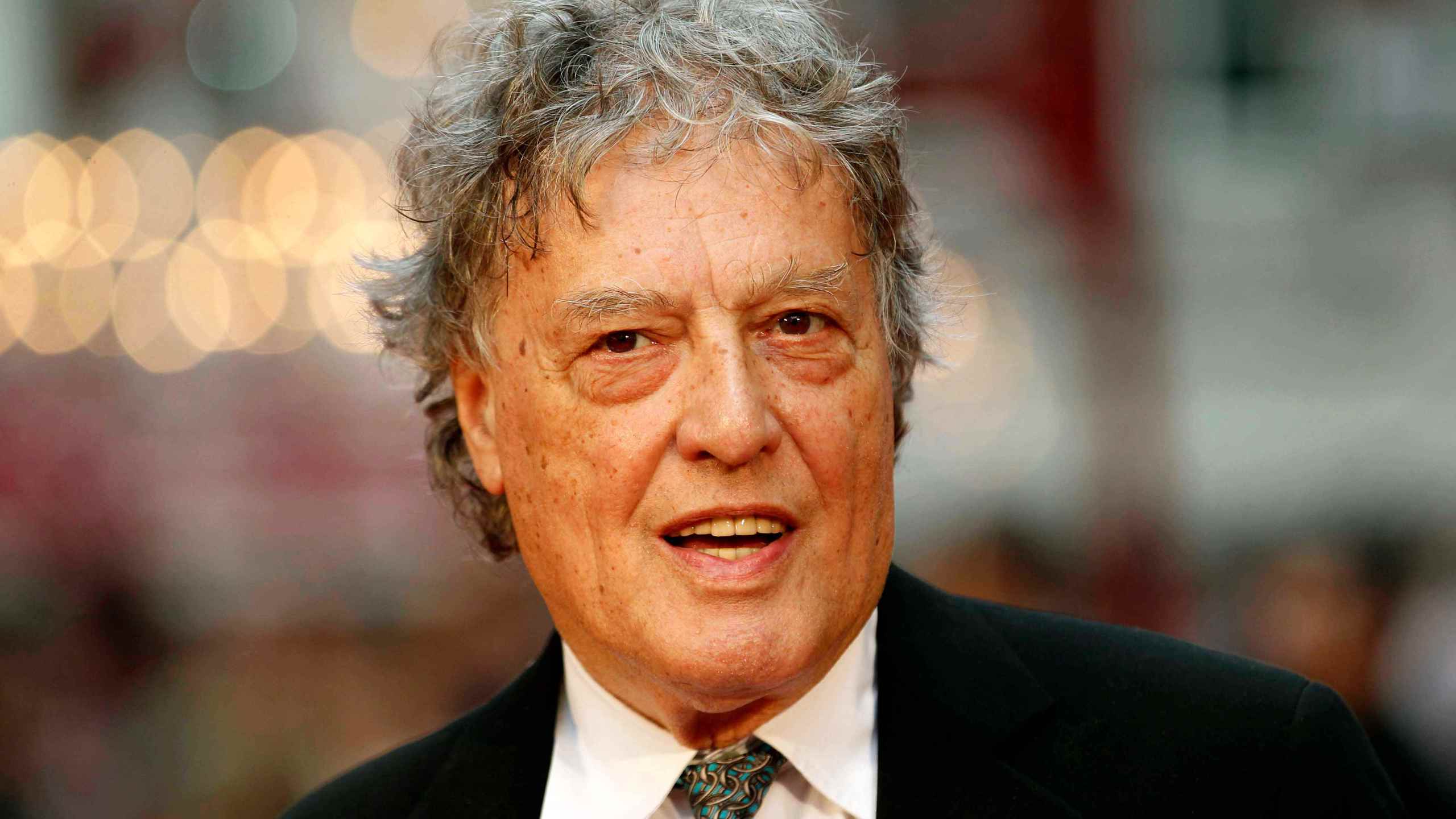 FILE - In this Sept. 4, 2012 file photo, British playwright Tom Stoppard poses as he arrives for the world premiere of "Anna Karenina," in London. (AP Photo/Sang Tan, File)