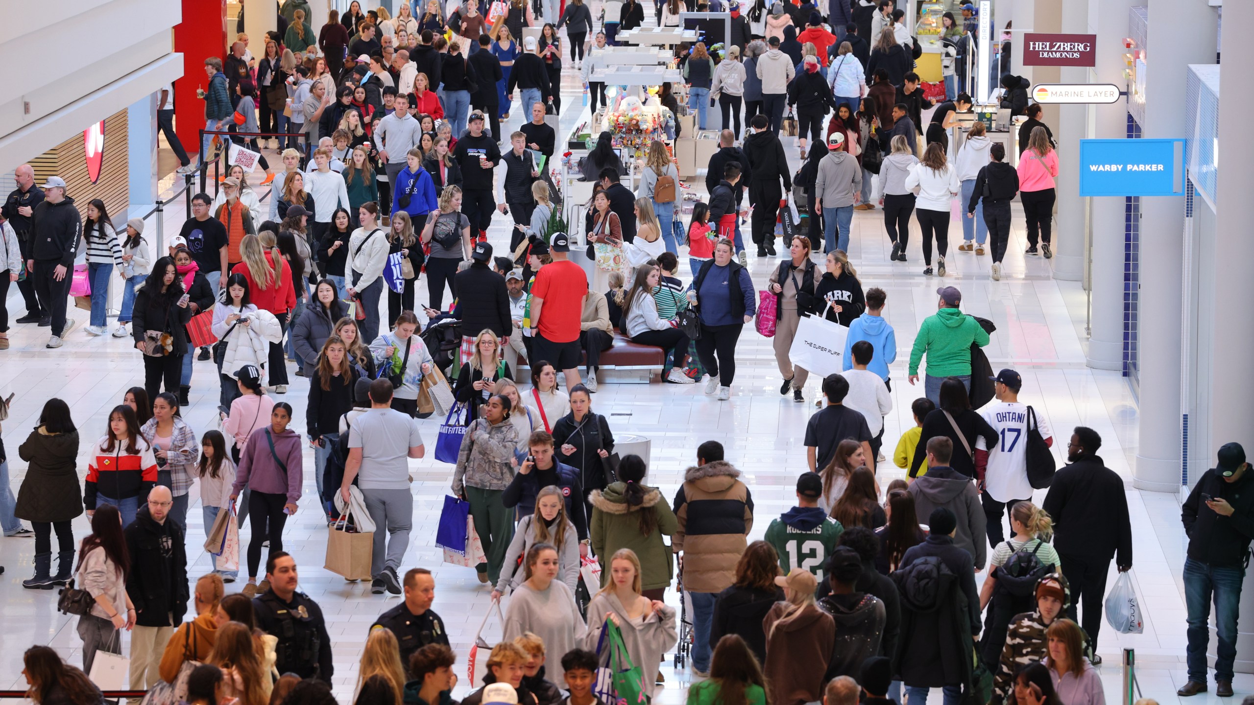 Shoppers browse through stores at Mall of America for Black Friday deals, Friday, Nov. 28, 2025, in Bloomington, Minn. (AP Photo/Adam Bettcher)
