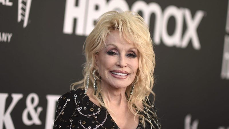 Dolly Parton poses for photos at an event
