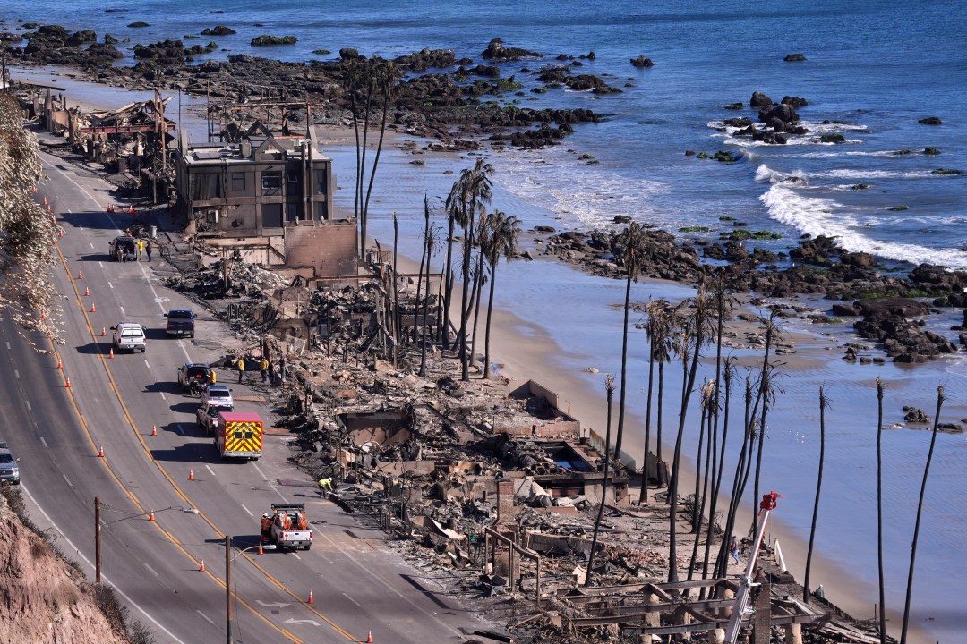 Homes along Pacific Coast Highway are seen burn out from the Palisades Fire.