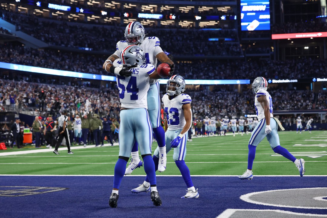 Dallas Cowboys defensive end Marshawn Kneeland and defensive end Sam Williams celebrate a touchdown