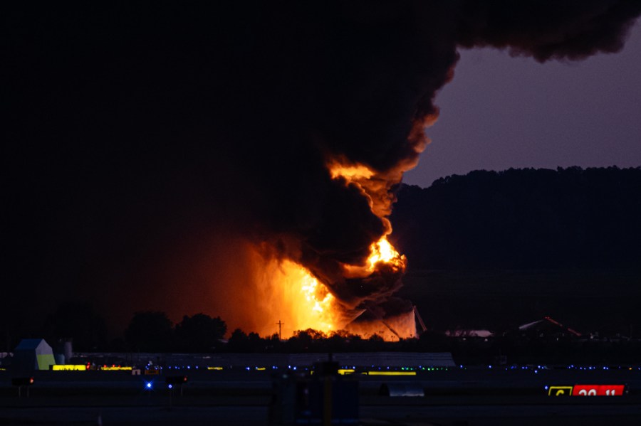 A fireball erupts near airport property