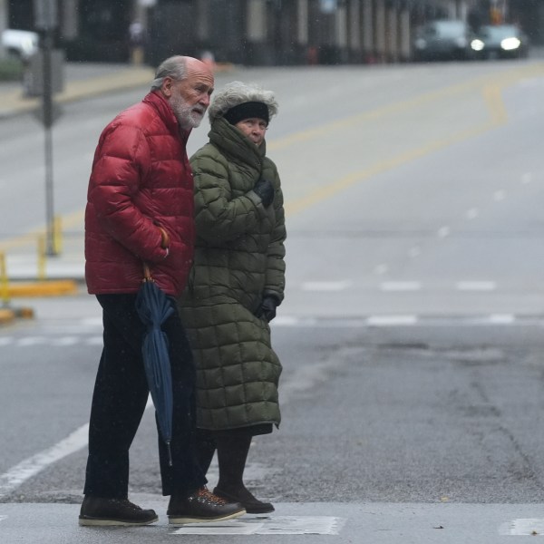 Pedestrians cross a street in Chicago
