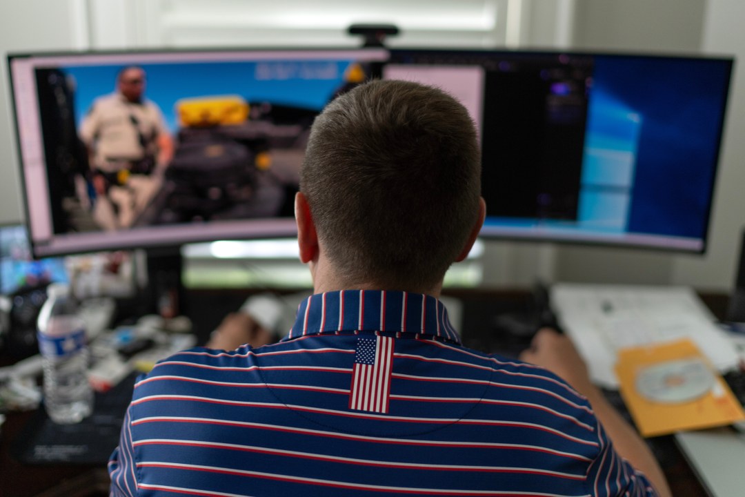 a man watching body camera video on a computer