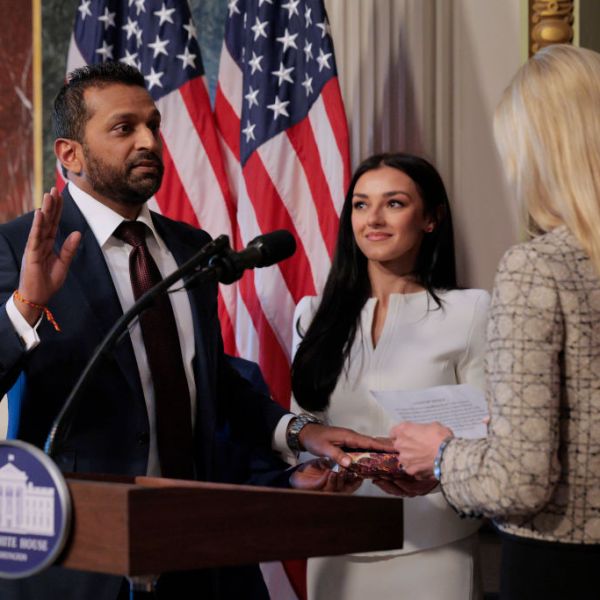 U.S. Attorney General Pam Bondi swears in the new Federal Bureau of Investigation Director Kash Patel as his girlfriend Alexis Wilkins holds the Bhagavad Gita