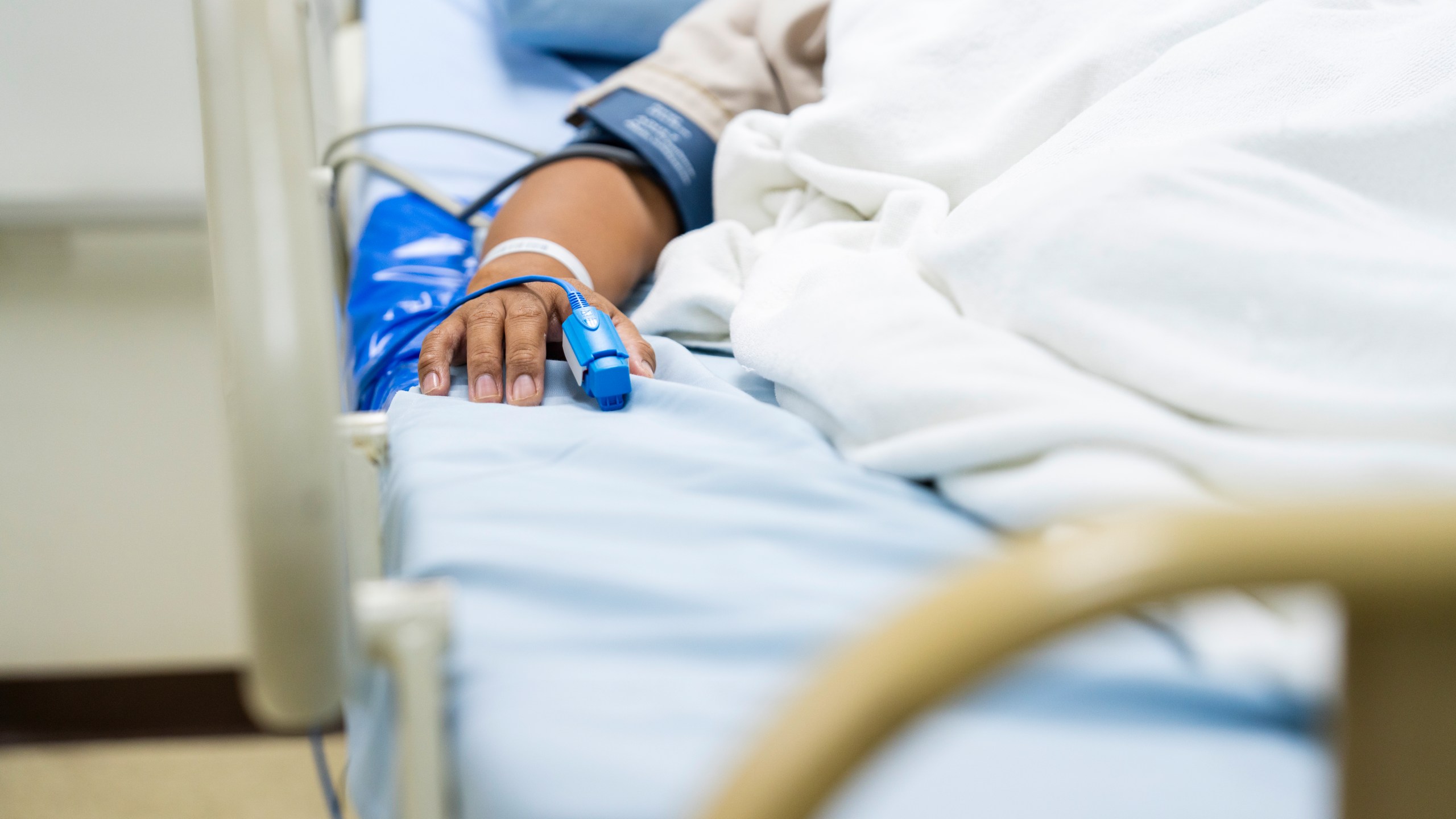 A patient lays in a hospital bed