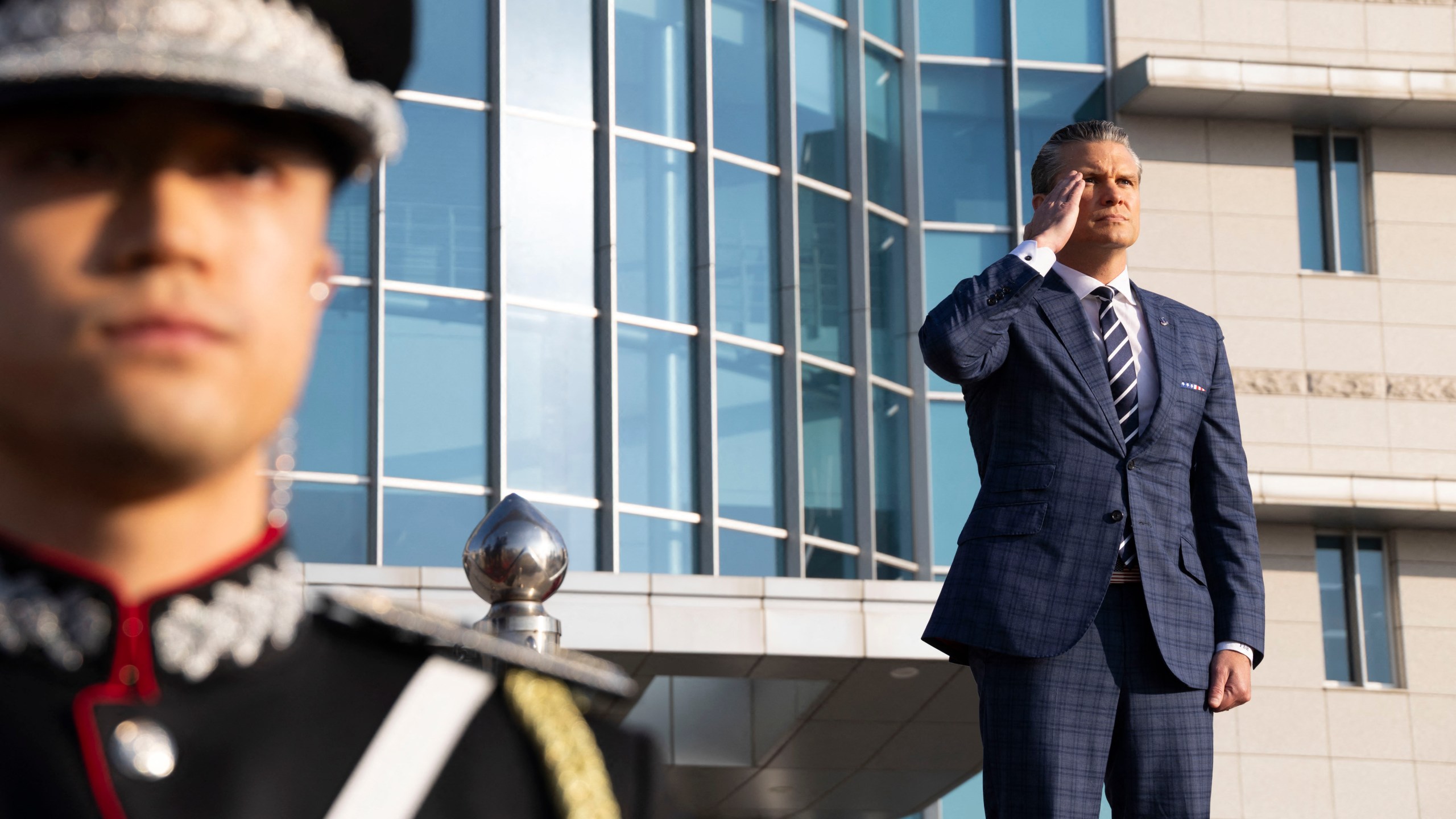 US Defense Secretary Pete Hegseth salutes as he inspect a guard of honor during a welcoming ceremony prior to the 57th Security Consultative Meeting (SCM) at the defense ministry in Seoul on November 4, 2025.