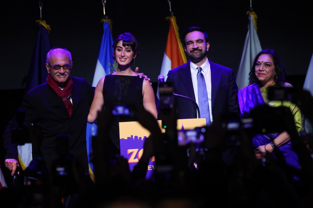 New York City mayor-elect Zohran Mamdani and wife Rama Duwaji smile onstage