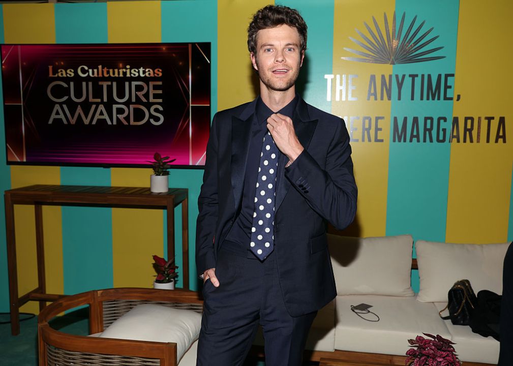 Jack Quaid poses for photos at an event