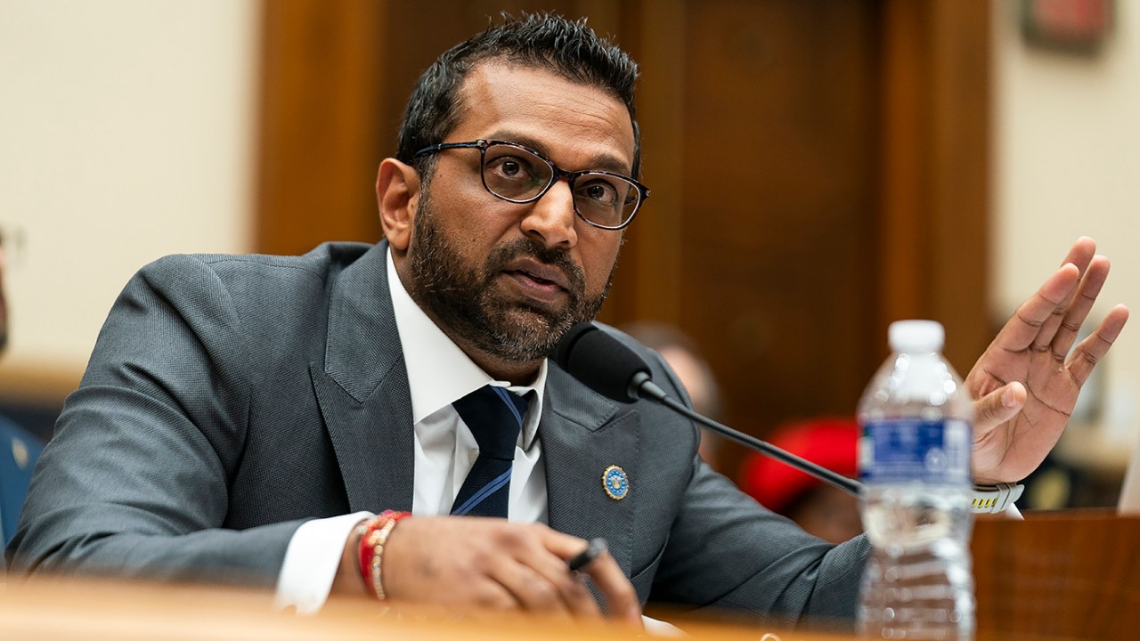 FBI Director Kash Patel speaks from a desk