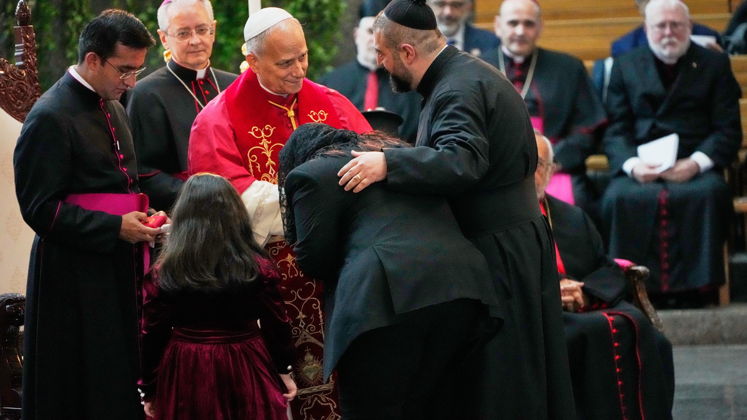 Pope Leo XIV greets worshippers at the Catholic basilica of Harissa, Lebanon, Monday, Dec. 1, 2025. (AP Photo/Hussein Malla)