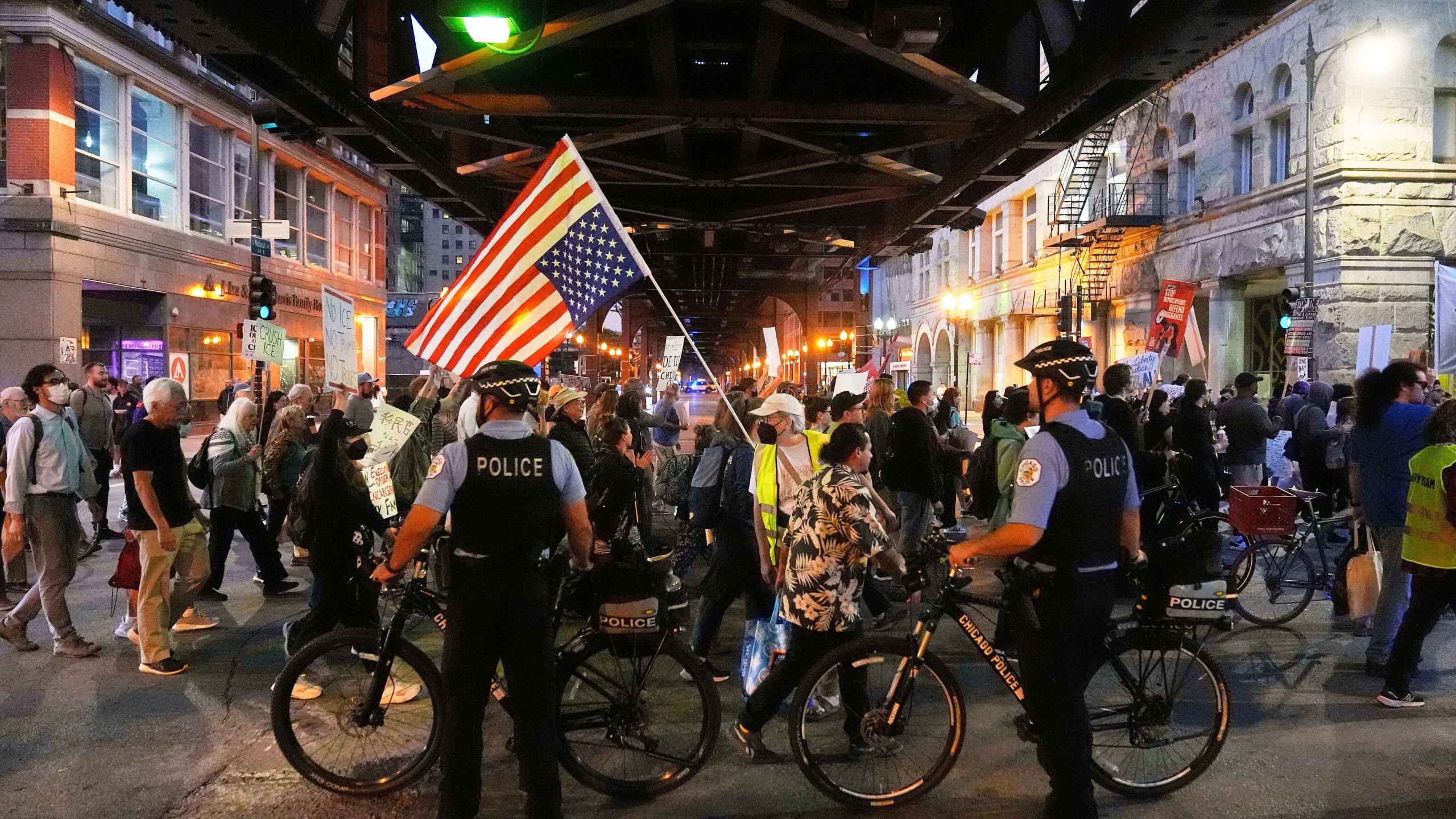 FILE - Police officers block a street as demonstrators march at a protest opposing "Operation Midway Blitz" and the presence of ICE, Sept. 9, 2025, in Chicago. (AP Photo/Erin Hooley, File)