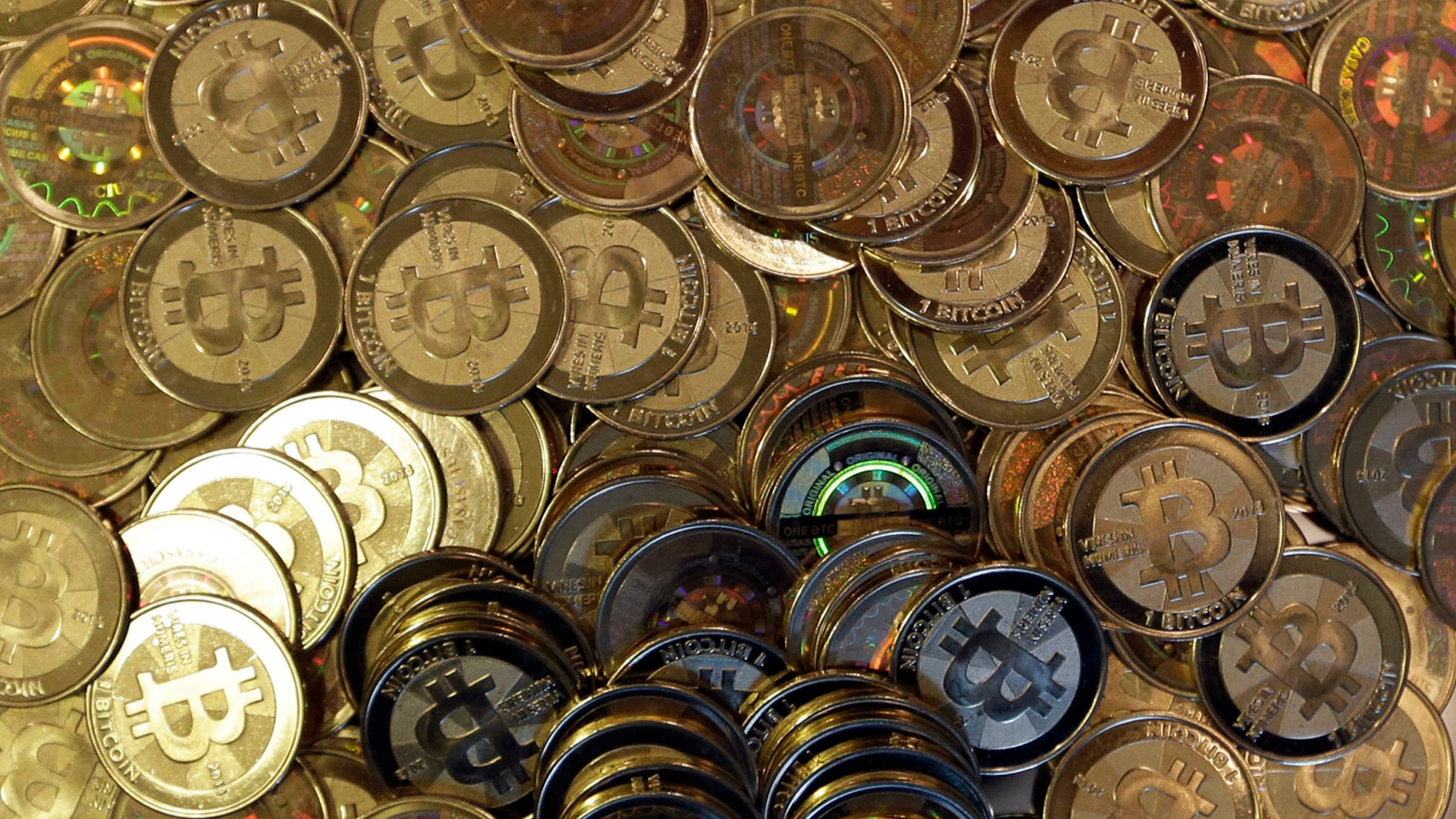 FILE - Bitcoin tokens are seen on April 3, 2013, in Sandy, Utah. (AP Photo/Rick Bowmer, File)