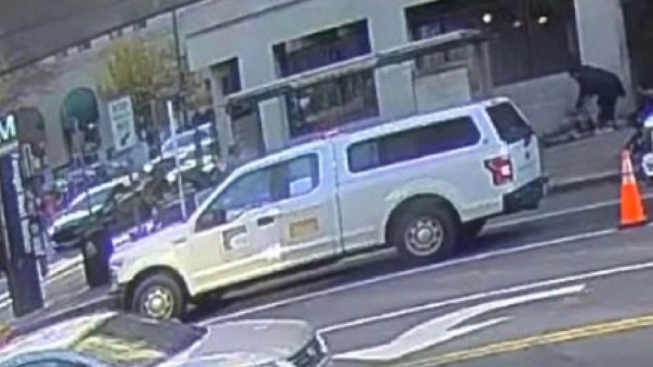 This image contained in a court filing by the Department of Justice on Tuesday, Dec. 2, 2025 shows the the defendant, Rahmanullah Lakanwal, top right, bending down next to Specialist Sarah Beckstrom and Staff Sgt. Andrew Wolfe after shooting them, according to police. (Department of Justice via AP)