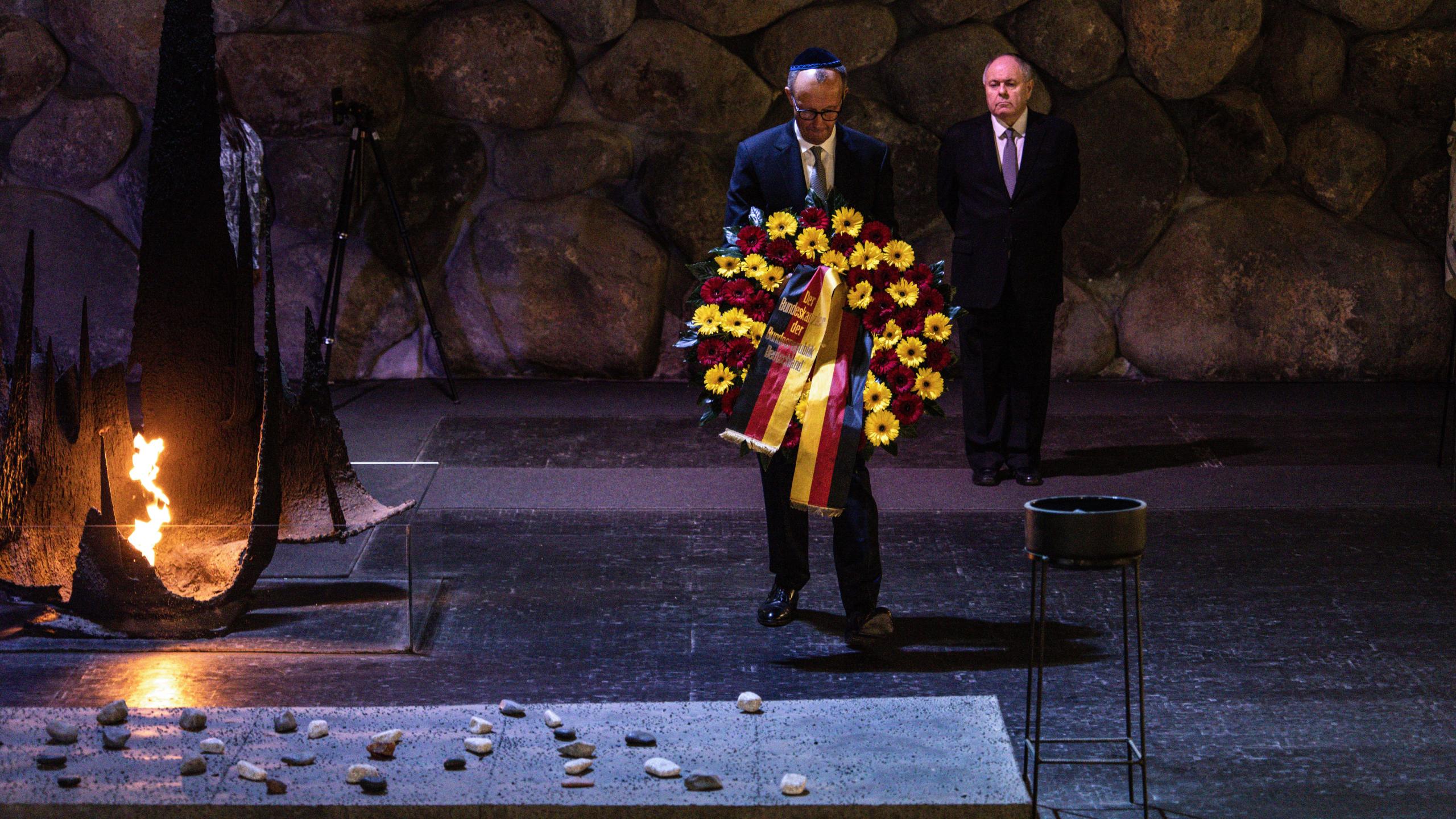 German Chancellor Friedrich Merz lays a wreath at the Hall of Remembrance during his visit to the Yad Vashem Holocaust Memorial Museum in Jerusalem, Sunday, Dec. 7, 2025. (John Wessels, Pool Photo via AP)