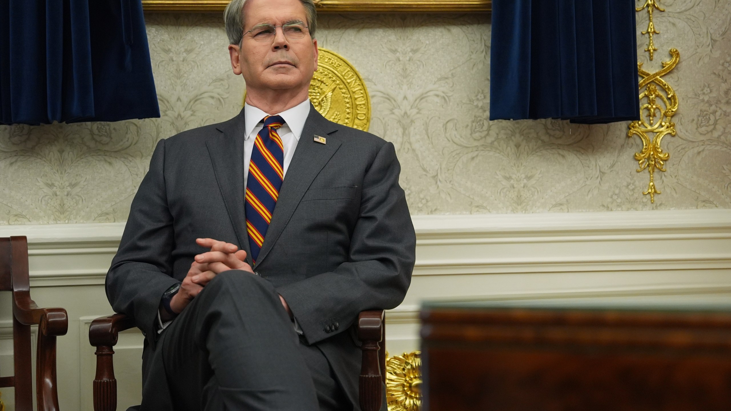 Treasury Secretary Scott Bessent listens as President Donald Trump talks after meeting with New York City Mayor-elect Zohran Mamdani in the Oval Office of the White House, Friday, Nov. 21, 2025, in Washington. (AP Photo/Evan Vucci)