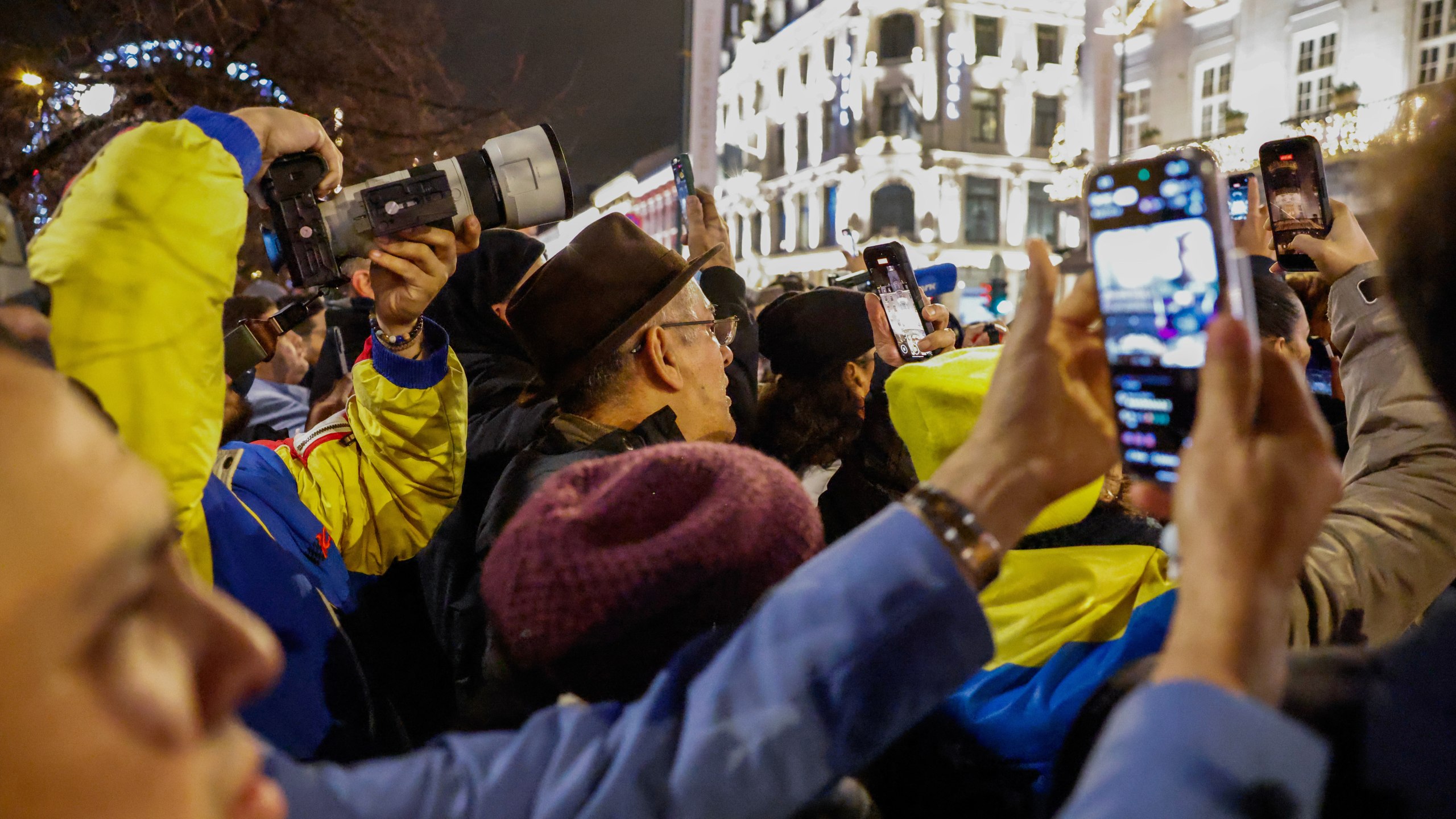 People wait to see Nobel Peace Prize laureate Maria Corina Machado outside the Grand Hotel, in Oslo, Norway, early Thursday, Dec. 11, 2025. (Jonas Been Henriksen/NTB Scanpix via AP)