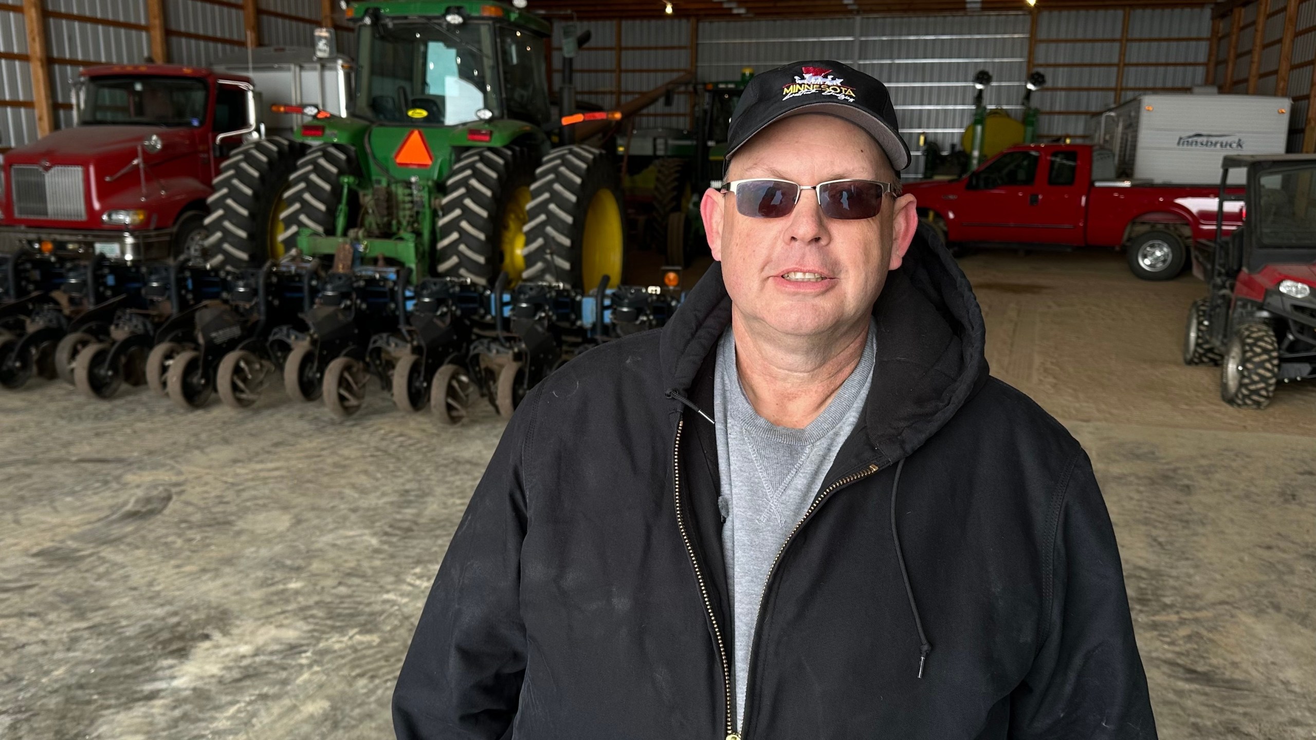 Charlie Radman, a corn and soybean farmer, stands for a photo on the land his family has owned since 1899, near Randolph, Minn., Wednesday, Dec. 10, 2025. (AP Photo/Mark Vancleave)