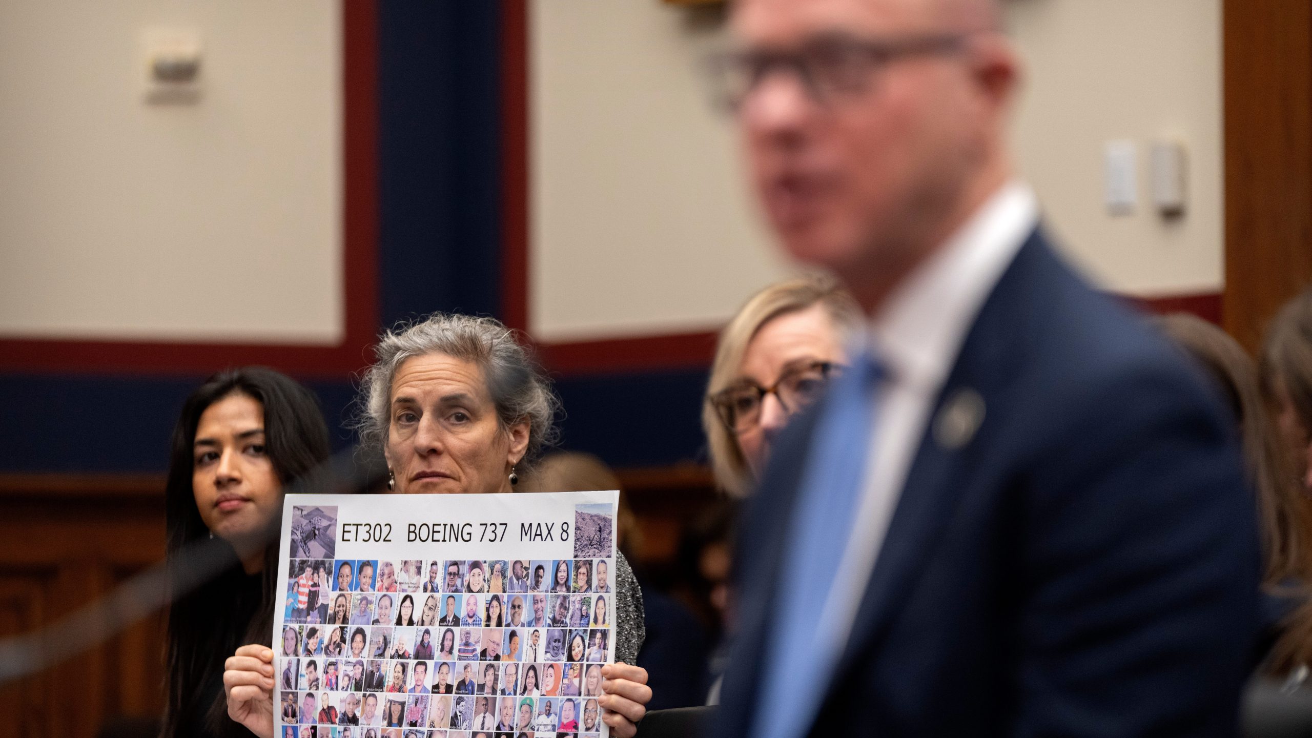 Nikita Joy of the Foundation for Aviation Safety, left, and Nadia Milleron of Sheffield, Mass., whose daughter Samya Stumo was killed in the crash of Ethiopian Airlines flight 302, listen as FAA Administrator Bryan Bedford speaks during a hearing of the Aviation Subcommittee of the House Transportation and Infrastructure Committee on Capitol Hill, Tuesday, Dec. 16, 2025, in Washington. (AP Photo/Mark Schiefelbein)