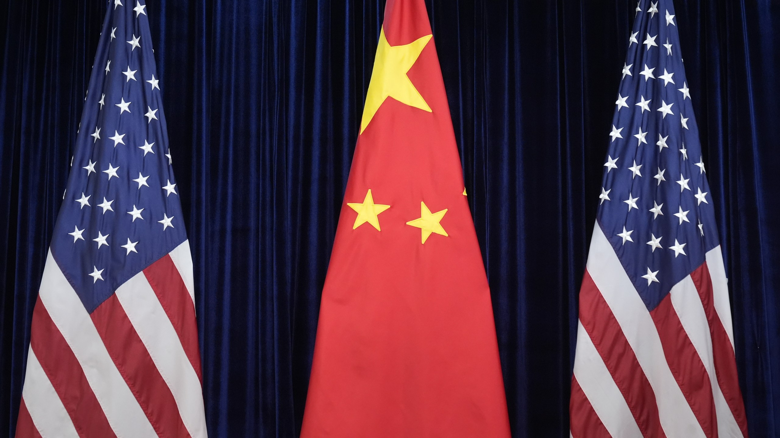 FILE - Flags of the U.S. and China are displayed at the Gimhae International Airport in Busan, South Korea, Oct. 30, 2025. (AP Photo/Mark Schiefelbein, file)
