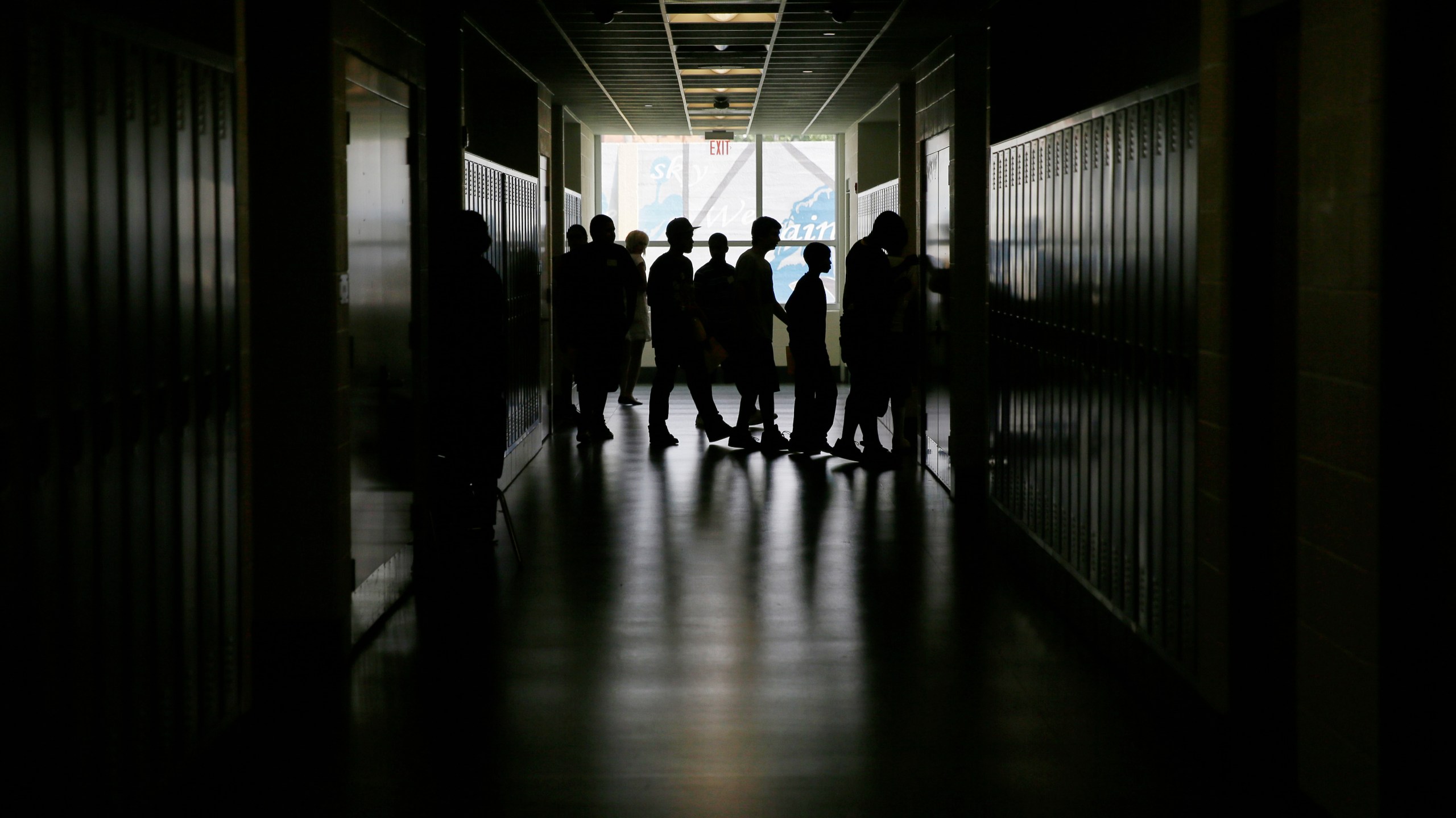 FILE - Students walk the halls at a high school in Philadelphia on Aug. 29, 2013. (AP Photo/Matt Slocum, File)