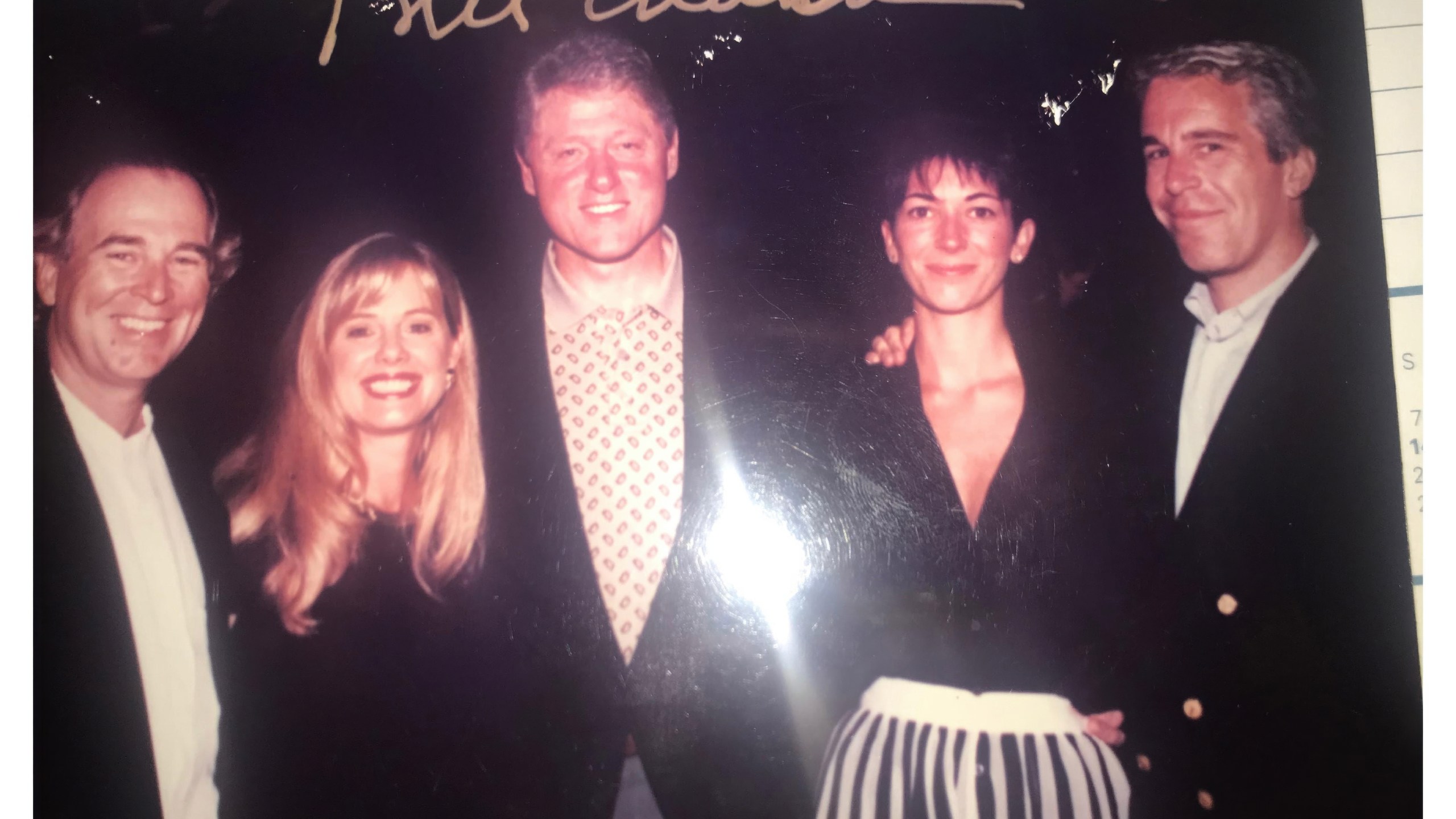This undated photo released by Democrats on the House Oversight Committee shows former President Bill Clinton, Ghislaine Maxwell and Jeffrey Epstein, with Clinton's signature at the top of the photo. (House Oversight Committee via AP)