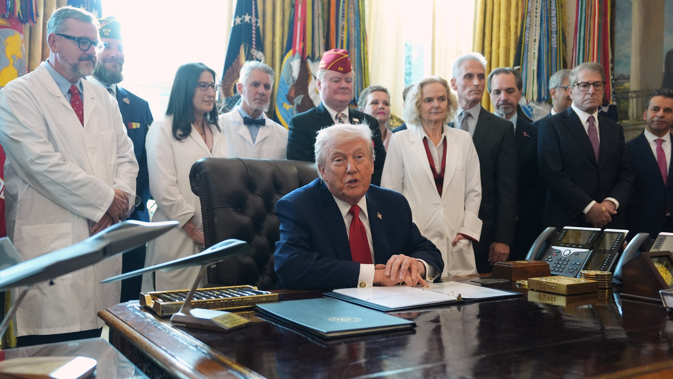 President Donald Trump speaks during an executive order signing in the Oval Office of the White House, Thursday, Dec. 18, 2025, in Washington. (AP Photo/Evan Vucci)