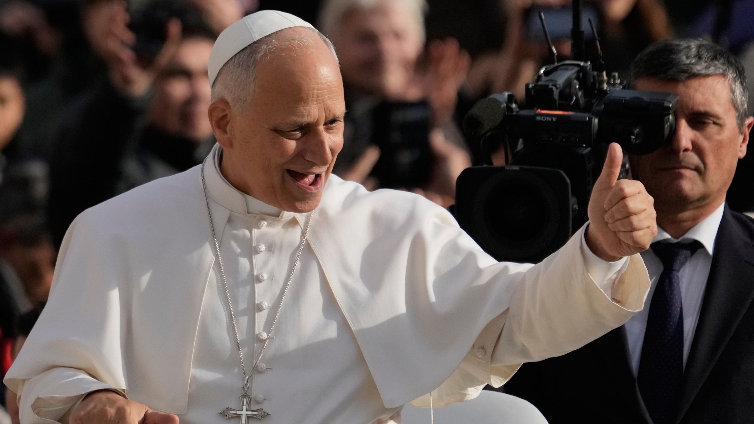 Pope Leo XIV greets faithful as he arrives in St. Peter's Square on the occasion of the last Jubilee audience, at the Vatican, Saturday, Dec. 20, 2025. (AP Photo/Gregorio Borgia)